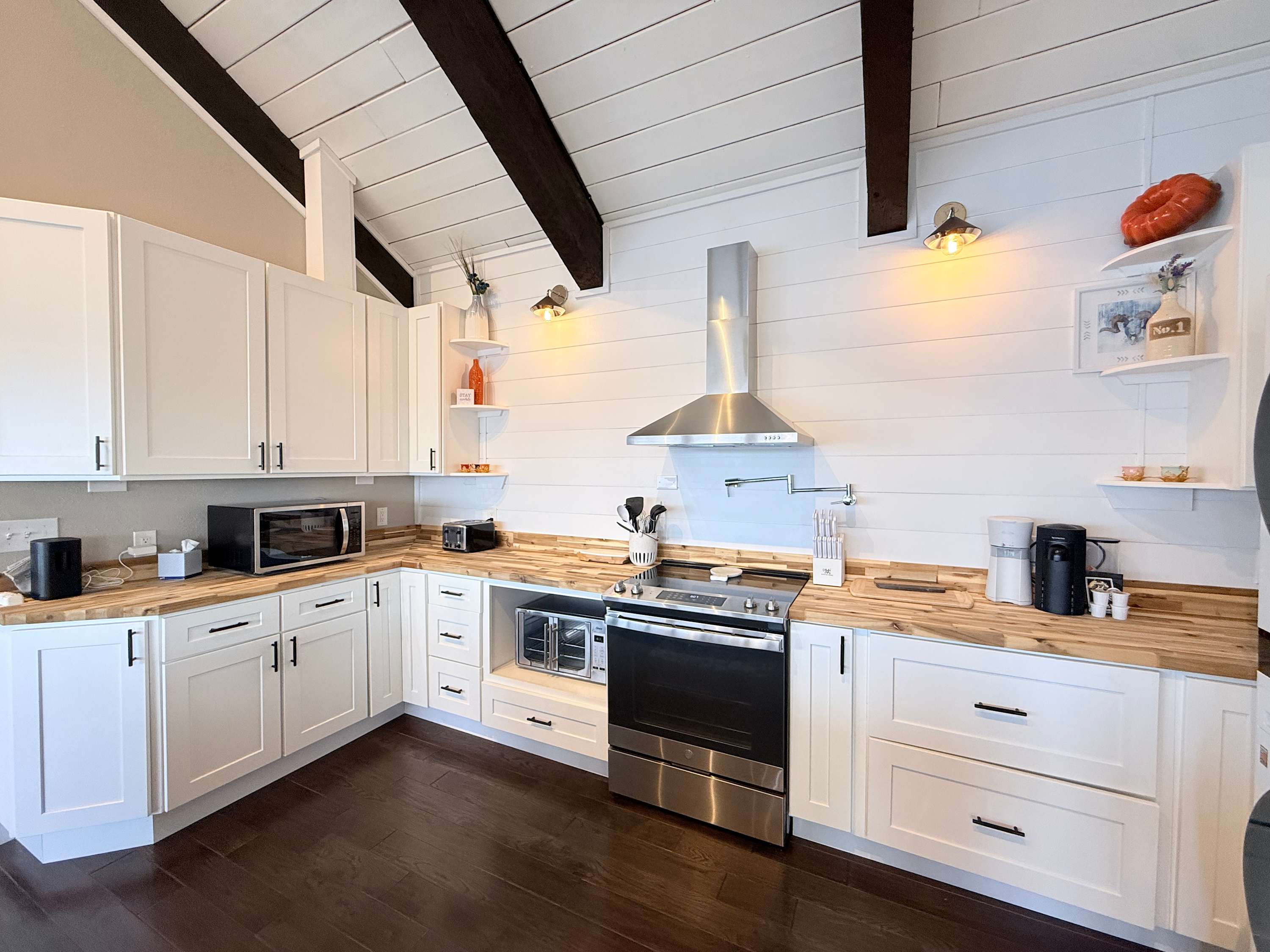 The breezy kitchen offers ample space & all the comforts of home​