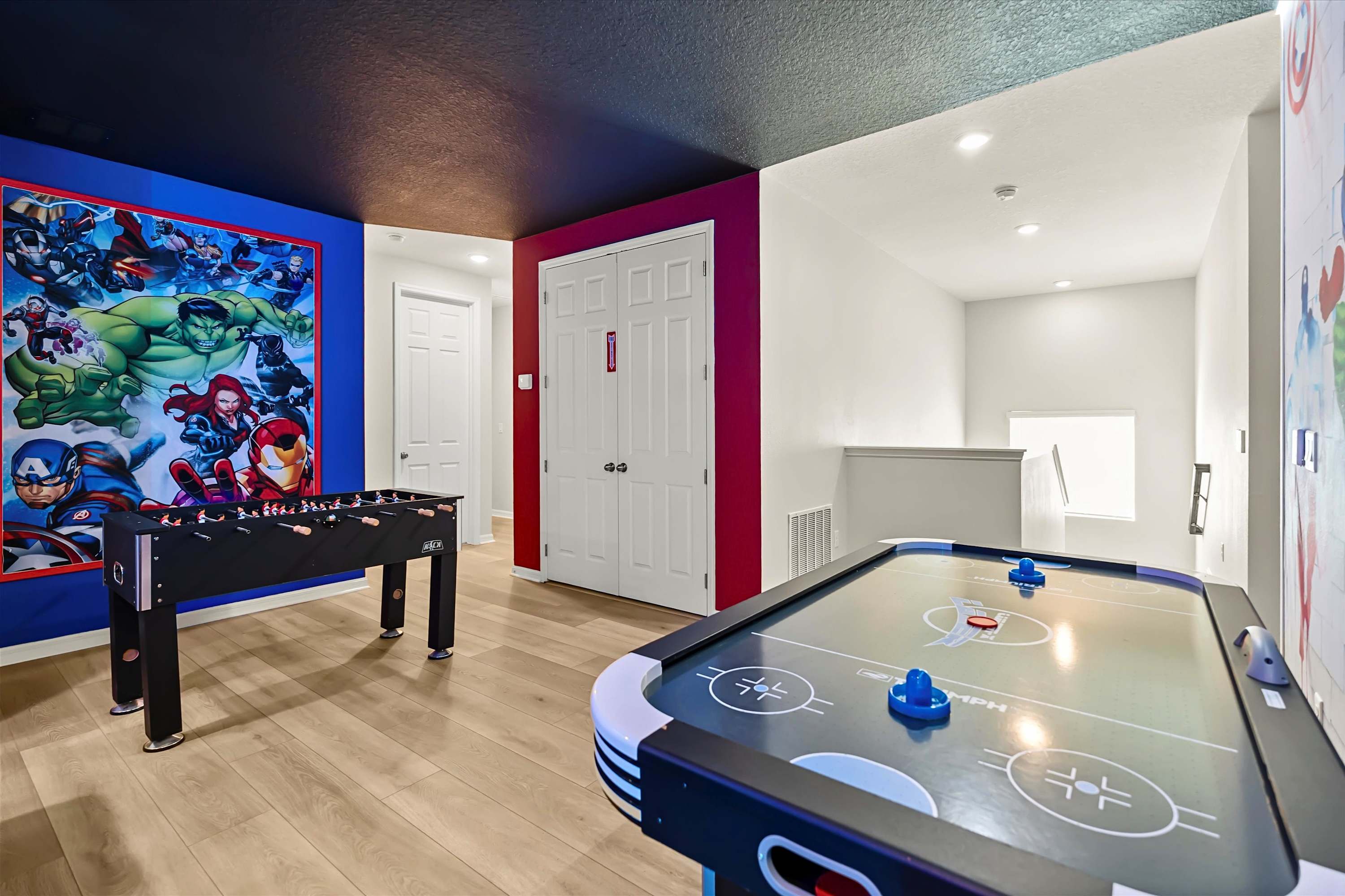 Game room with air hockey and foosball, ideal for fun with kids, families, and friends