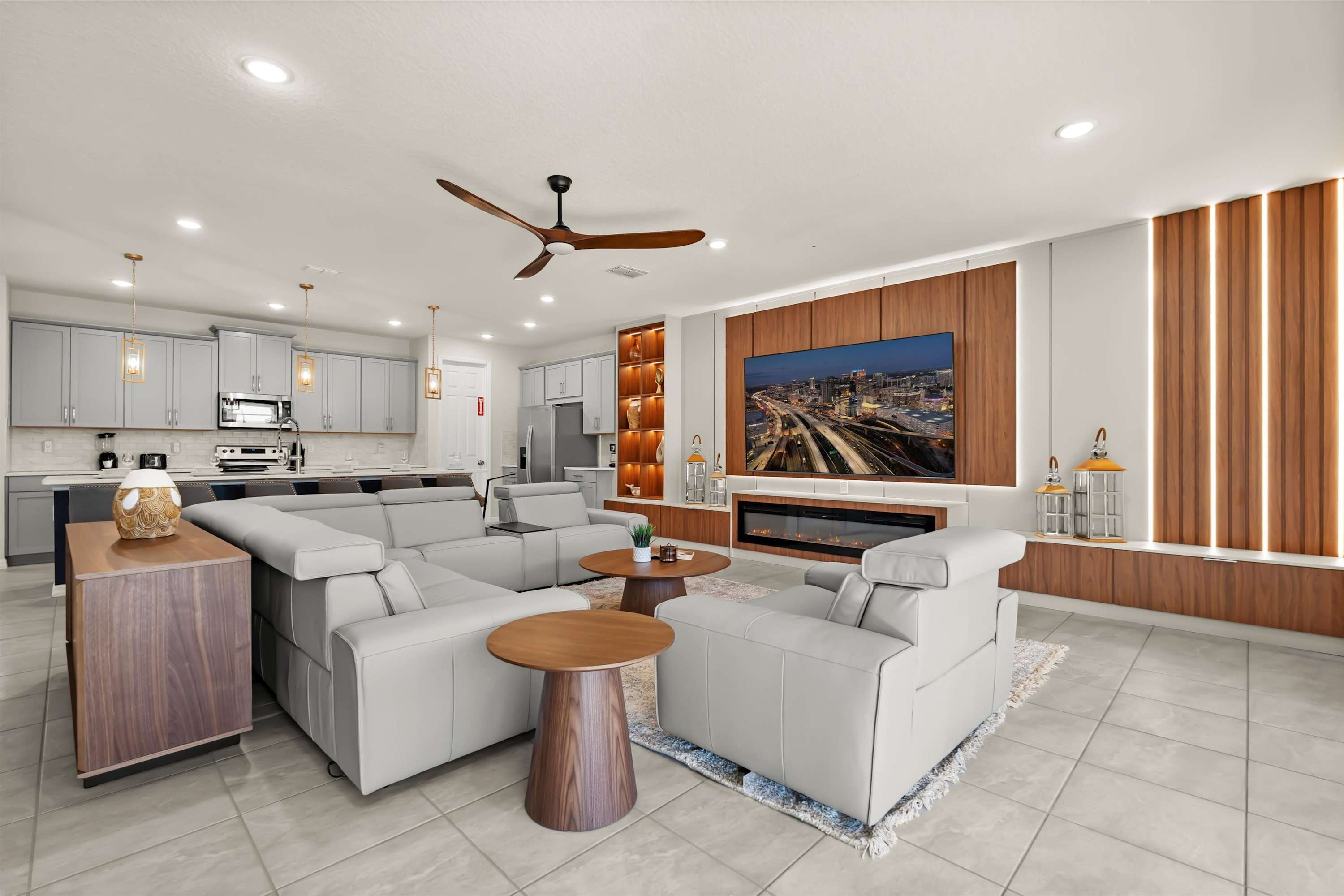 Bright living area with ample seating and TV, overlooking the kitchen for shared group moments