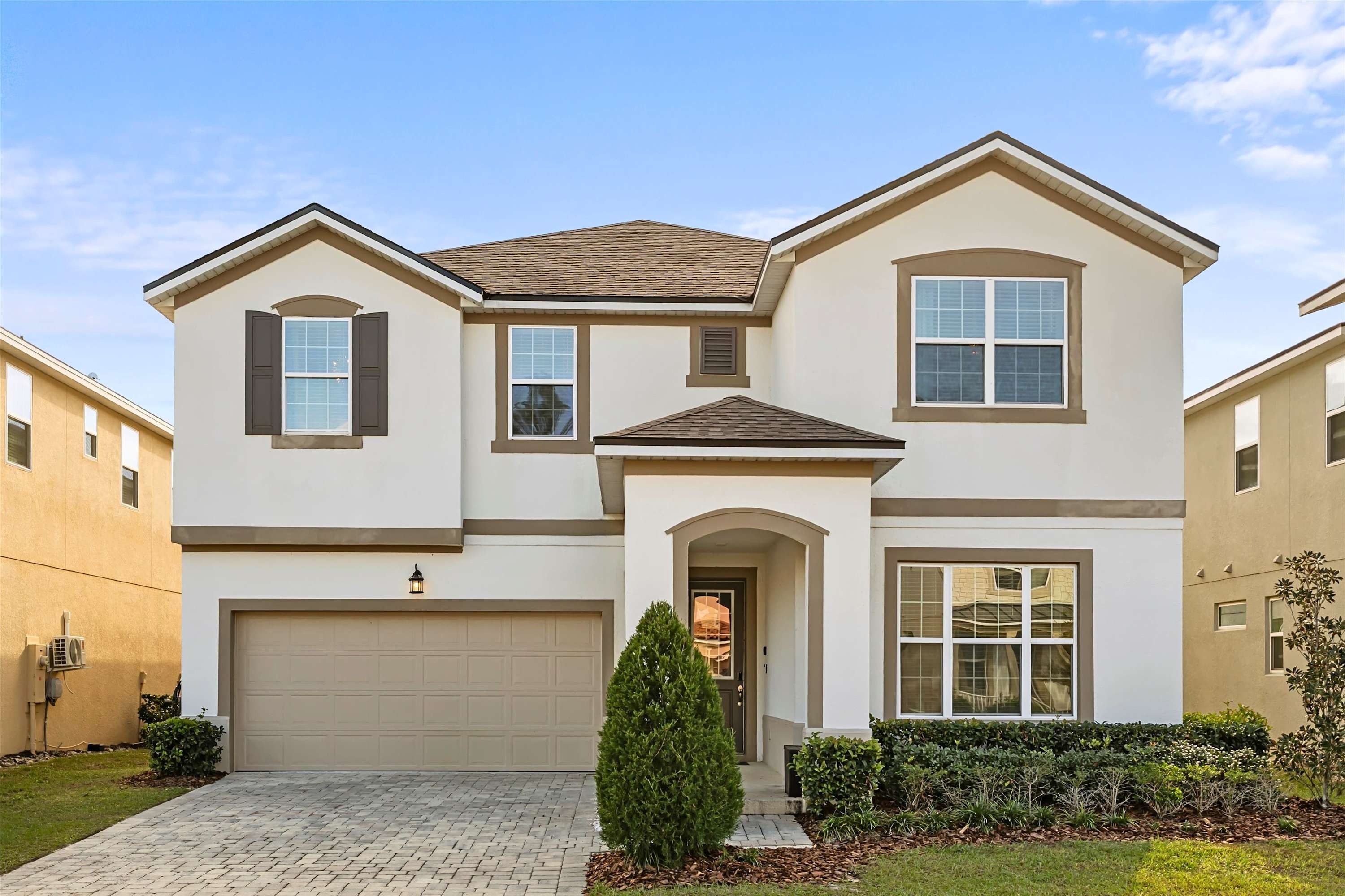 Modern facade with sleek design and parking for two, perfect for easy arrivals