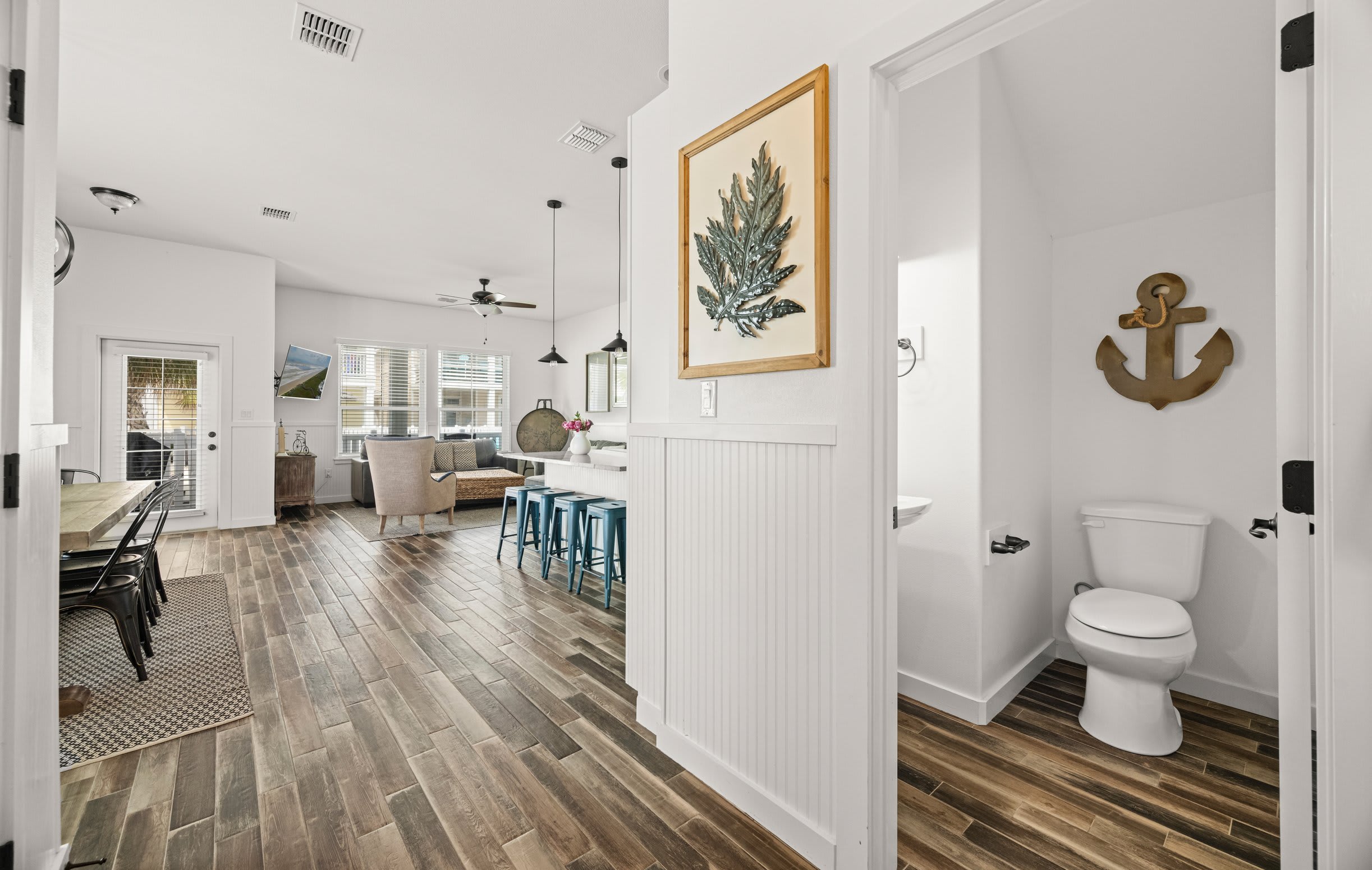 Entry & Half Bath — Seaweed Art, Wainscoting, Open Floor Plan View & Anchor Wall Art