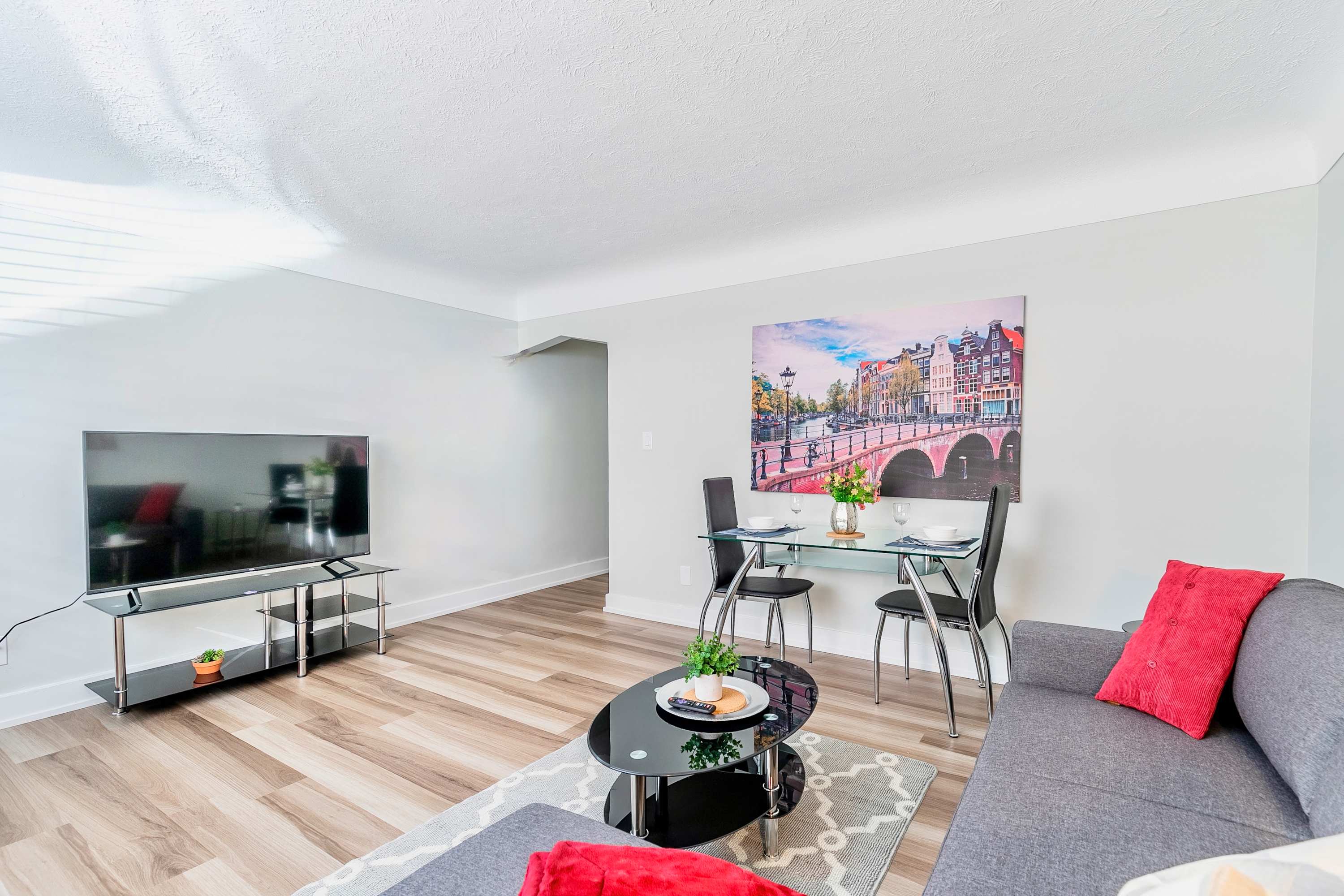 Enjoy meals in the dining area and unwind while watching your favorite shows in this comfortable, connected living space