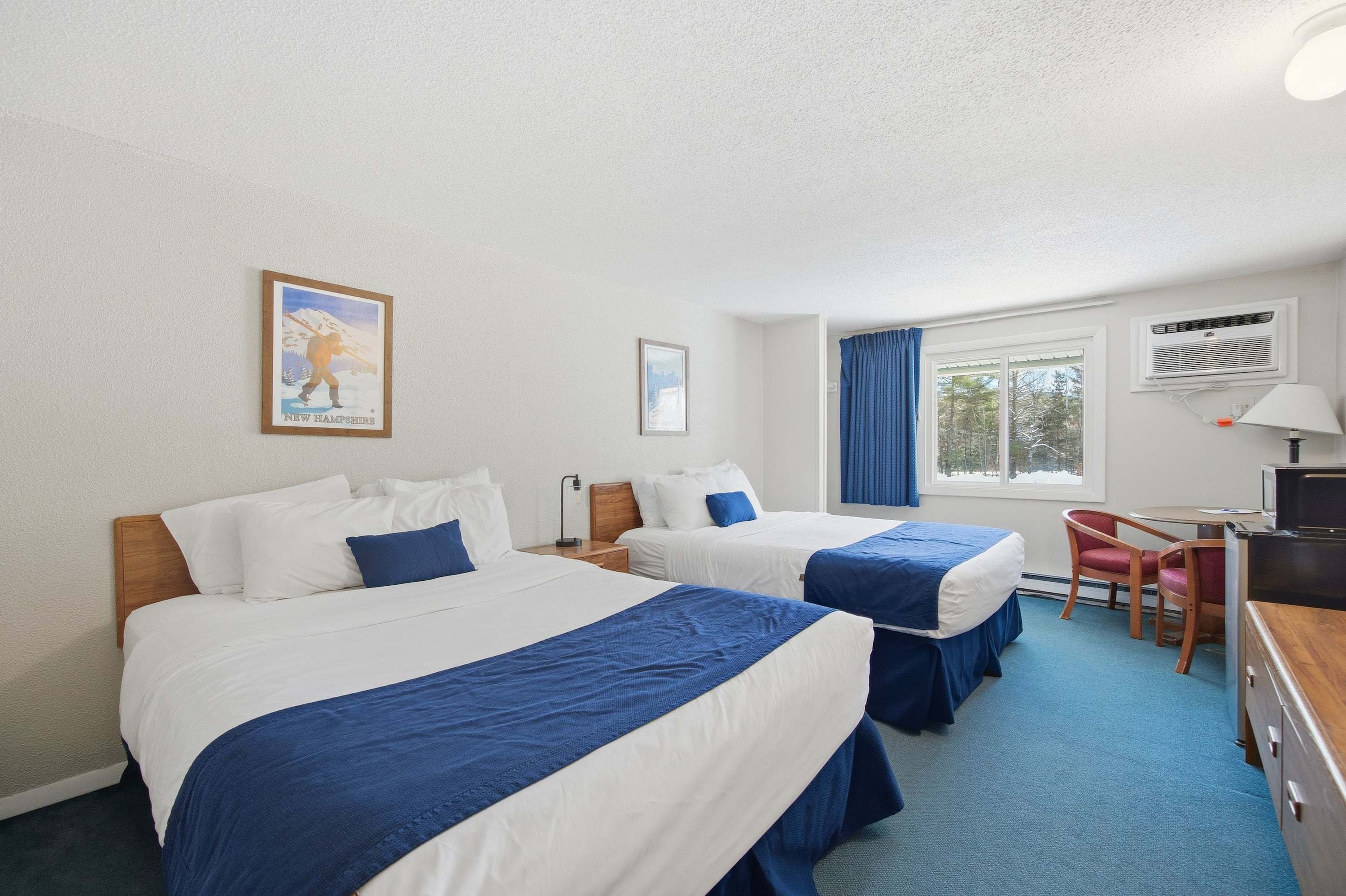 Recharge with a pair of plush queen beds in this studio-style home​