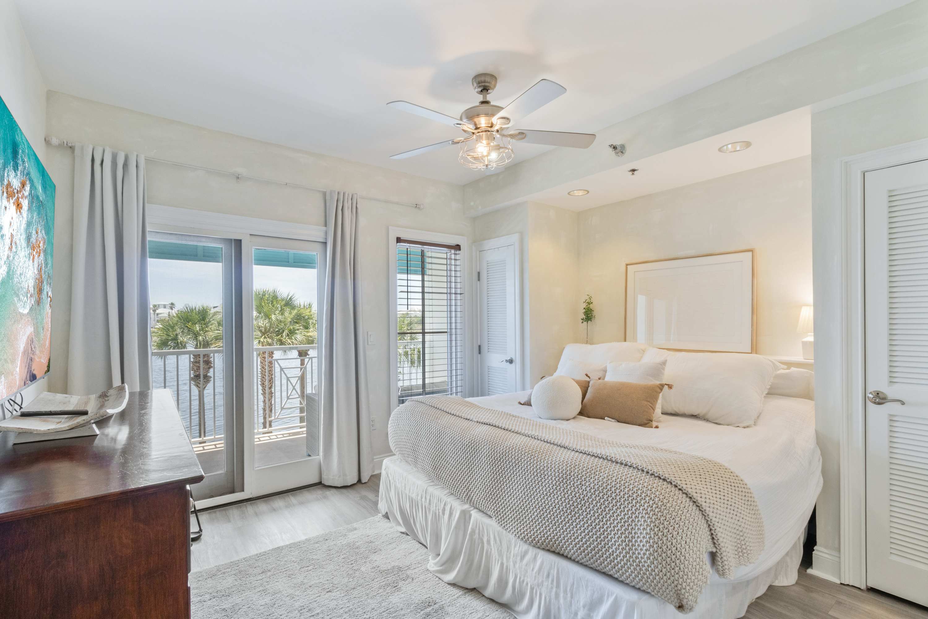King bed, 75" smart TV, private balcony with lake views, closet