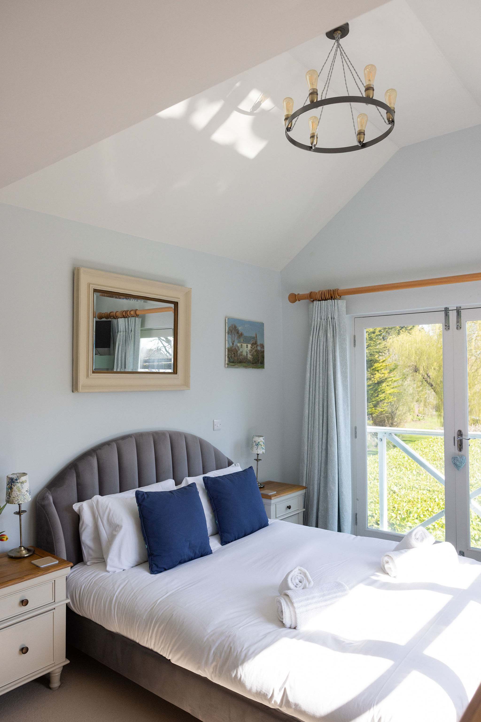 Bright master bedroom with Juliette balcony