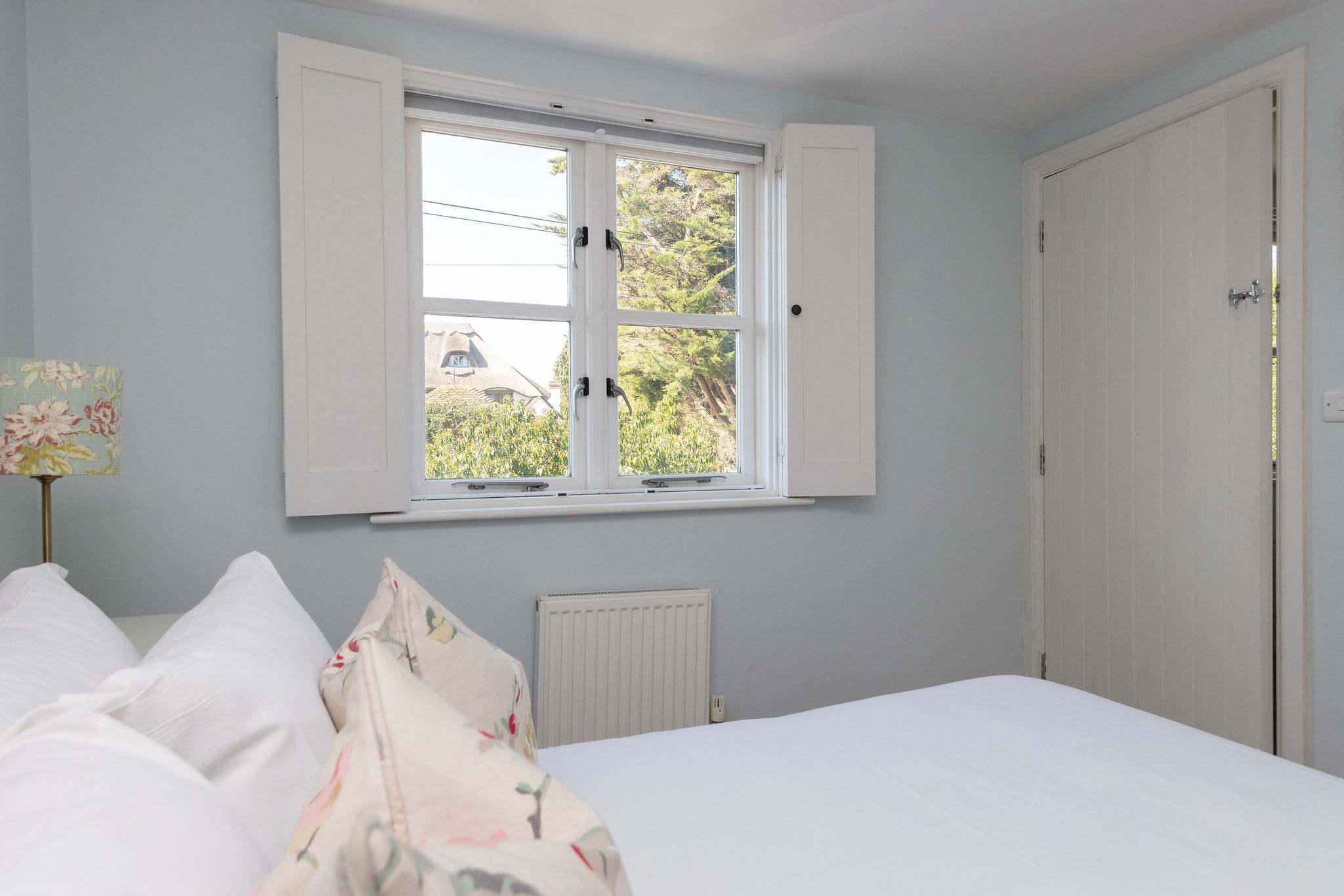 Light-filled bedroom with peaceful outlook