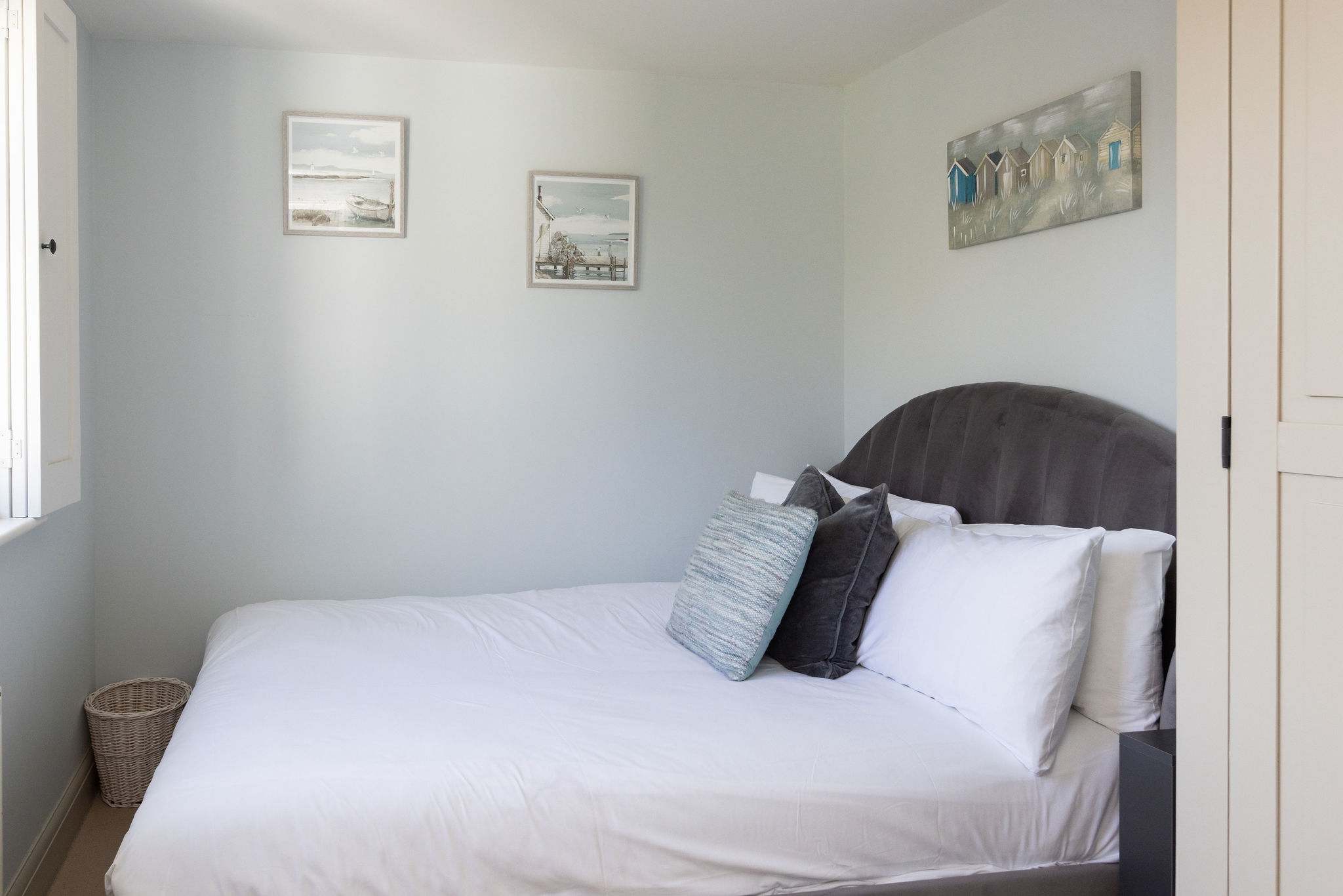 Cosy double bedroom with soft coastal styling