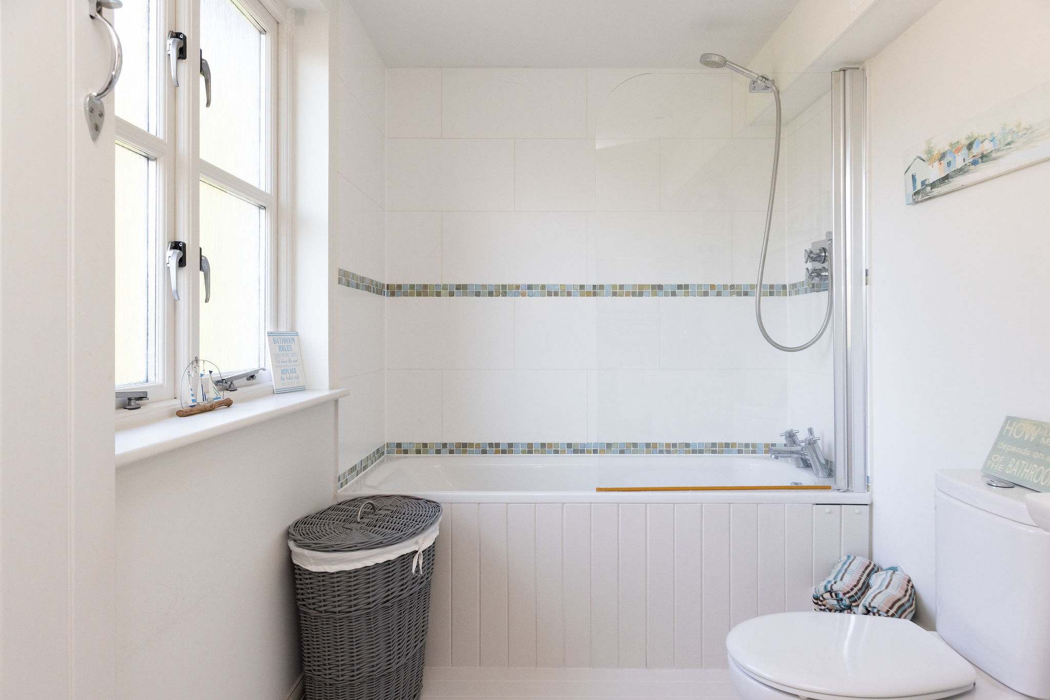 Family bathroom with bath and overhead shower