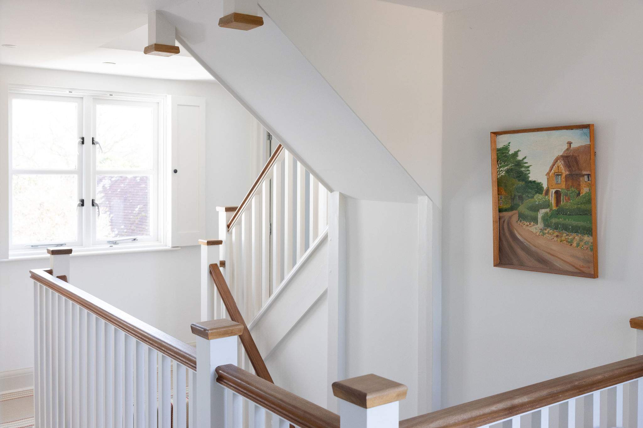 Light-filled landing with character staircase