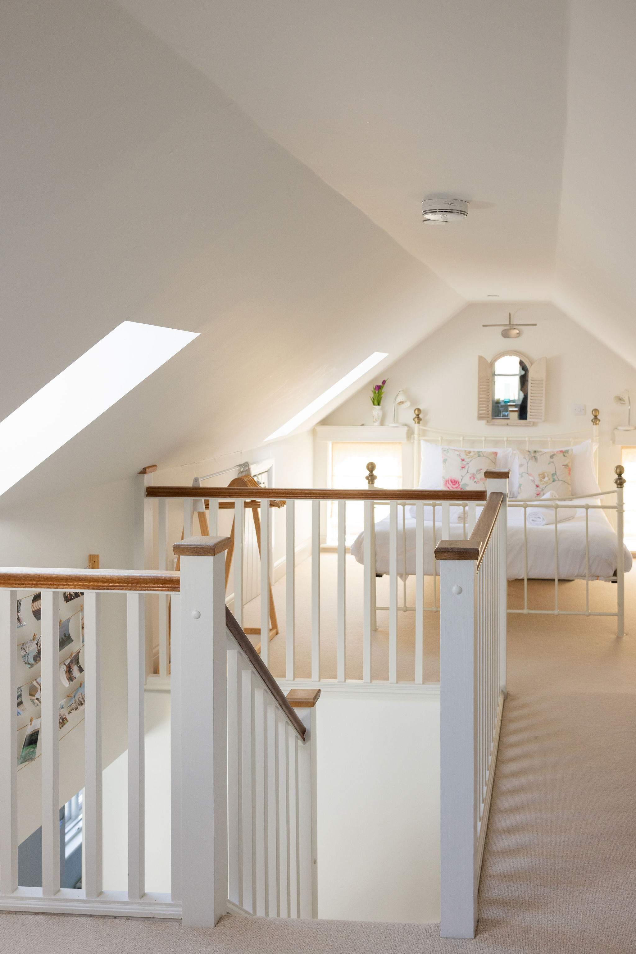 Charming loft bedroom with vaulted ceilings and soft natural light