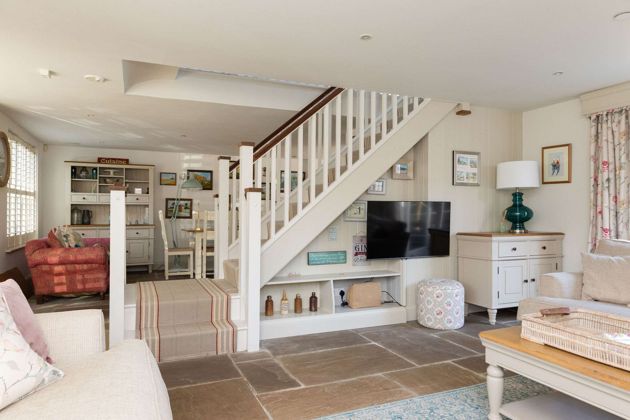 Spacious open-plan layout connecting living, dining and kitchen areas