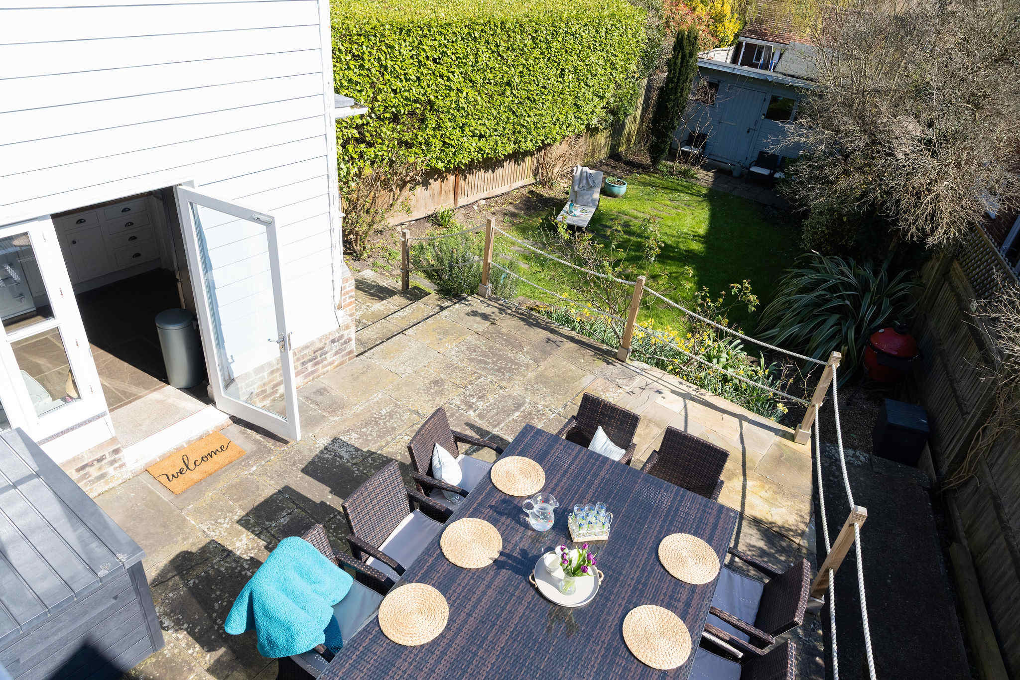 Spacious patio leading down to the enclosed garden