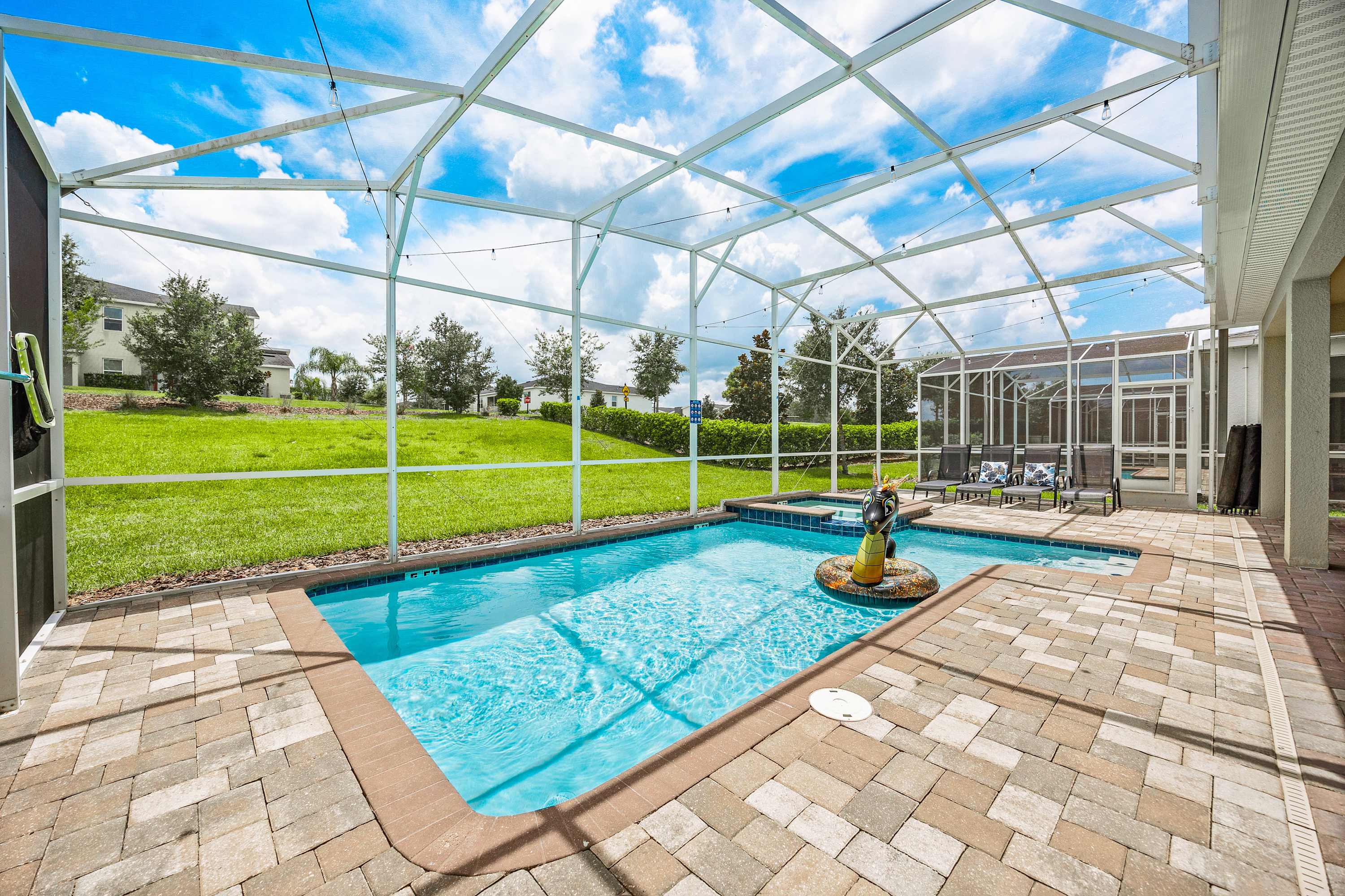 Private screened pool with spacious deck and open outdoor views.