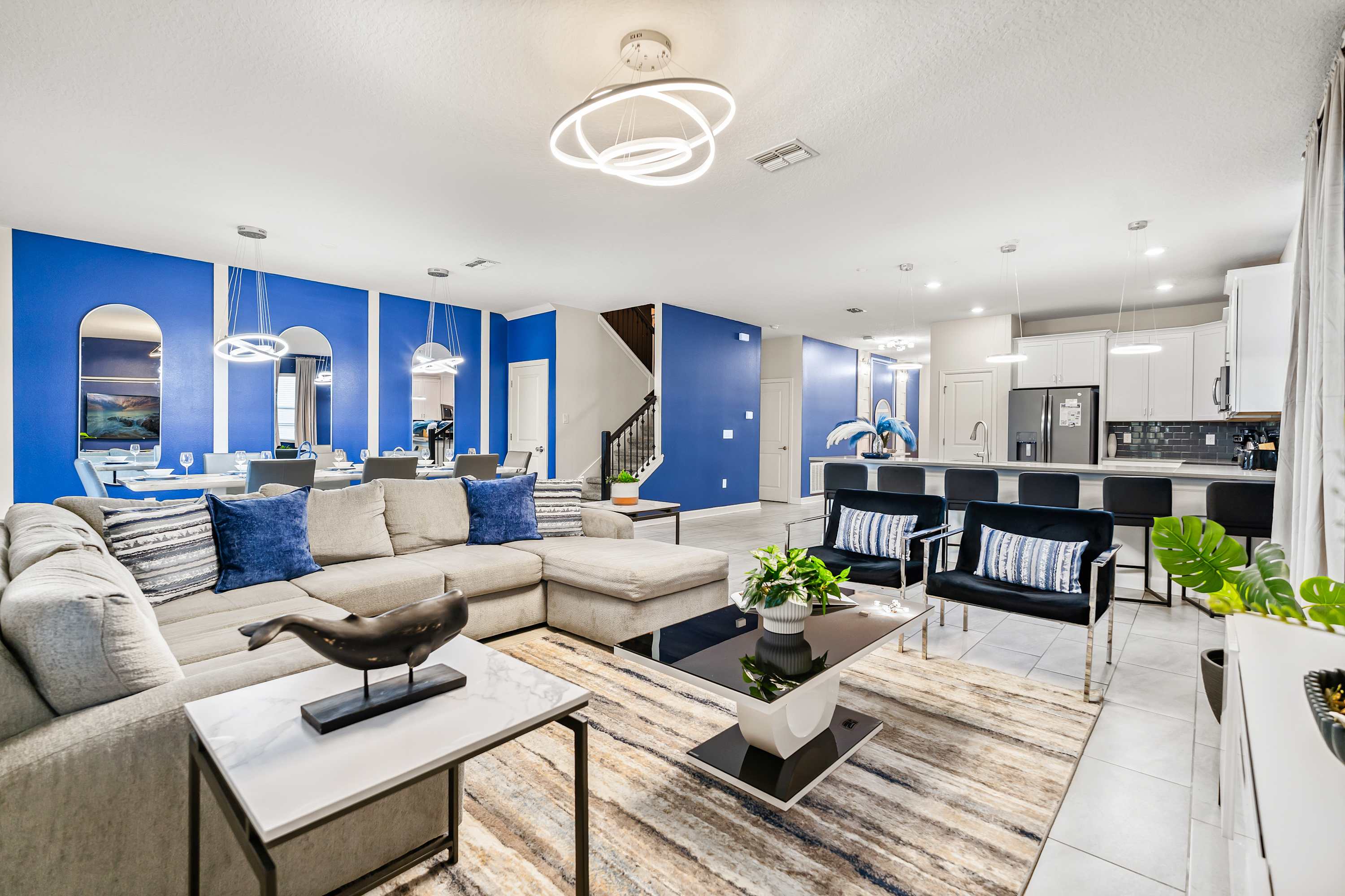 Spacious open-concept living area with comfortable seating and modern design.