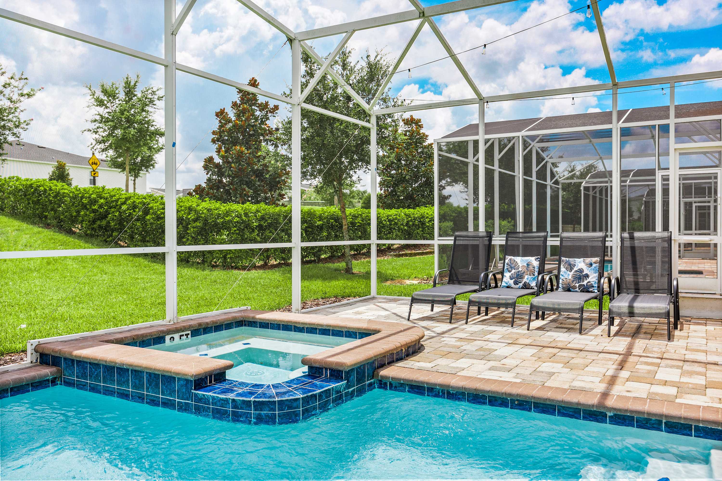 Private spa and patio seating area for outdoor relaxation and comfort.