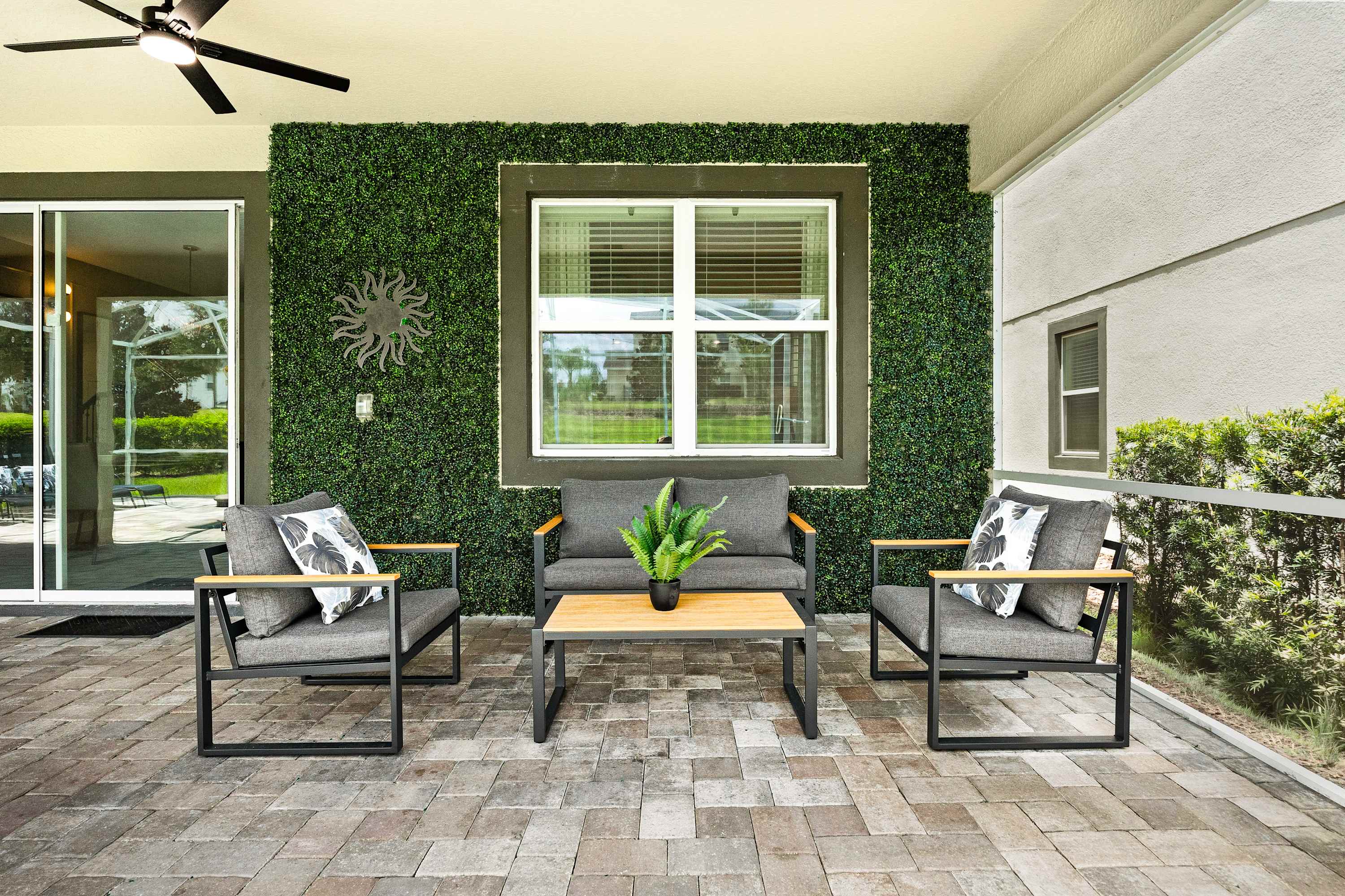 Cozy outdoor lounge with seating area, ideal for relaxing and enjoying the space.