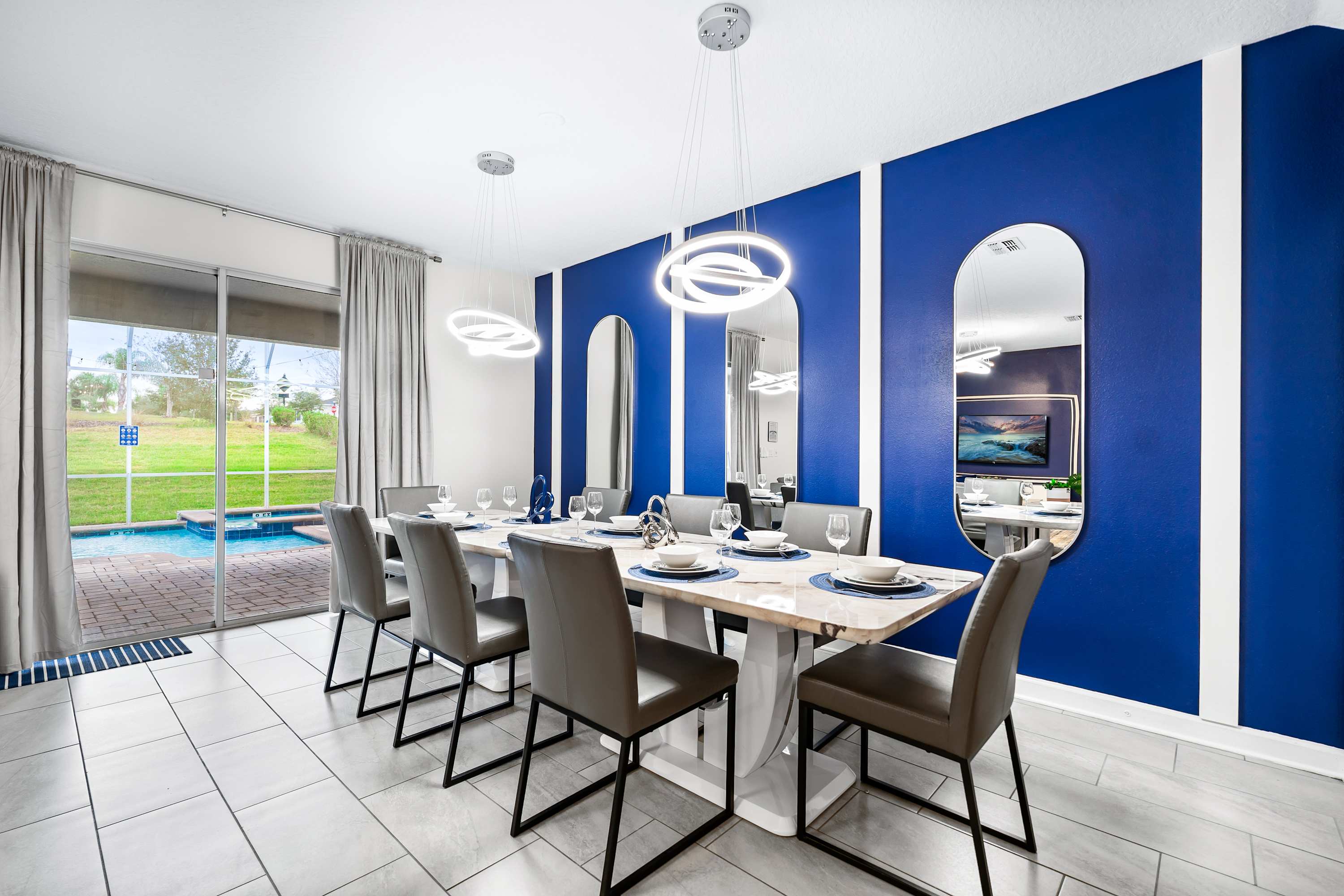 Elegant dining space with large table and seating, perfect for group meals.