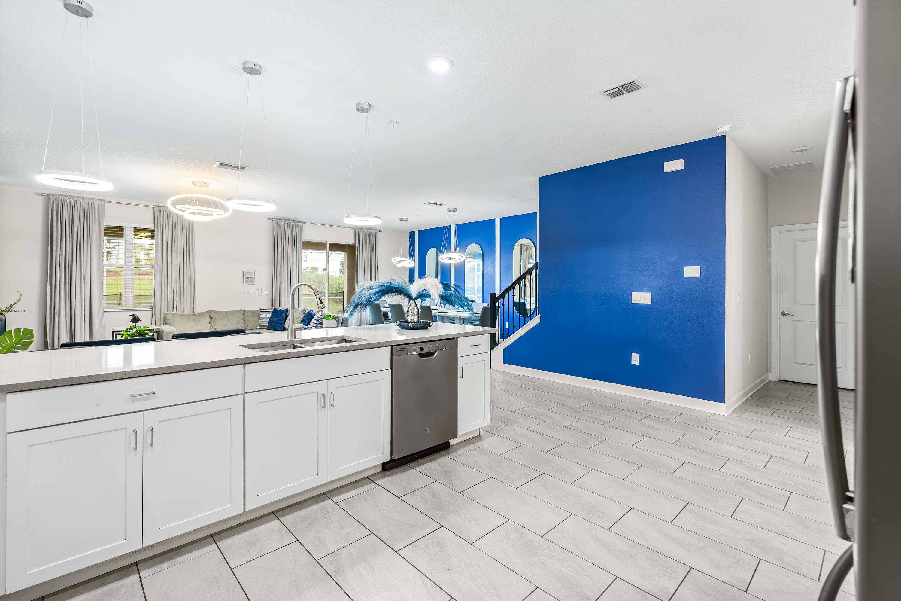 Open kitchen with large counter space and island, ideal for cooking and gathering.