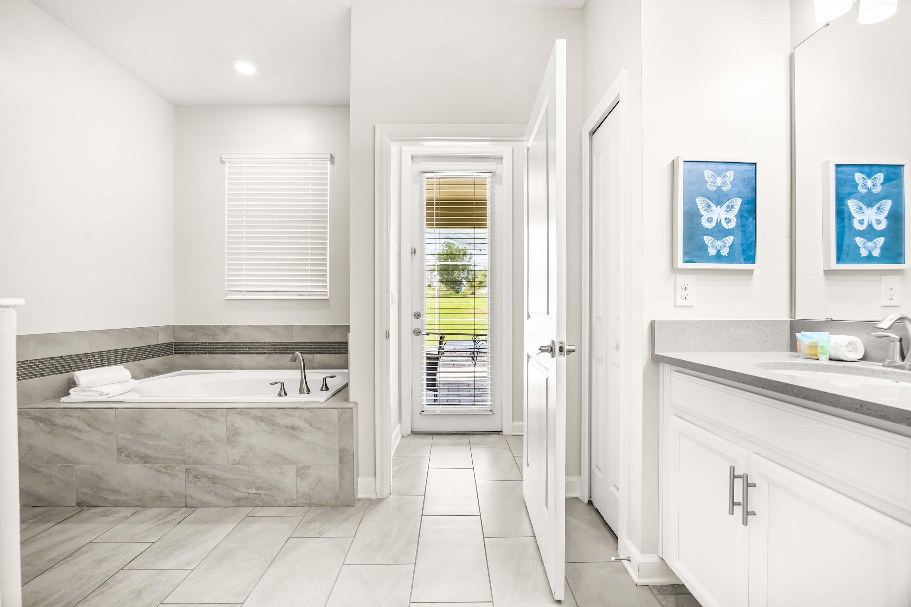 Private ensuite bathroom with double vanity and clean, modern finishes.