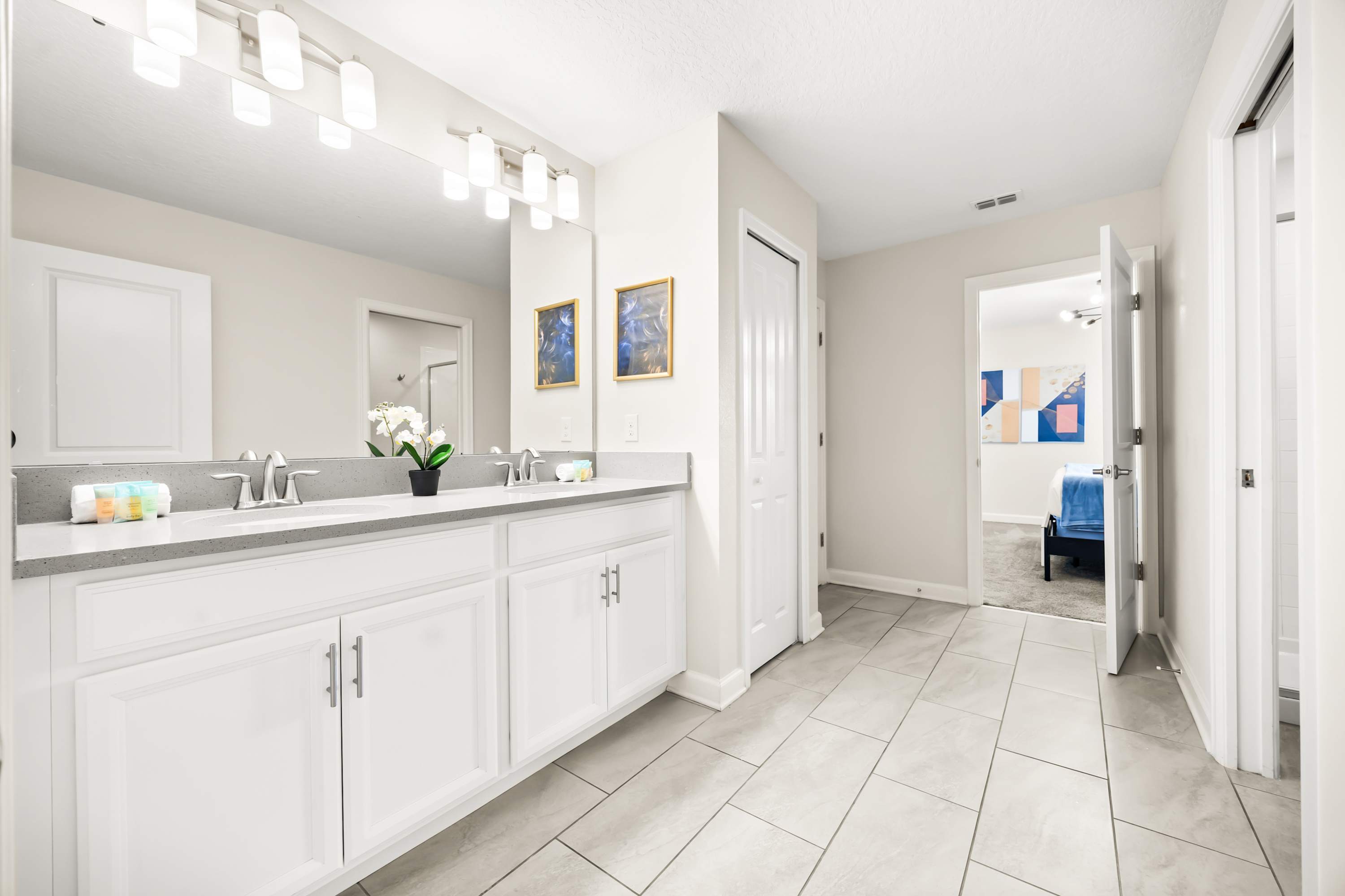 Spacious bathroom with extended vanity and ample counter space for added comfort.