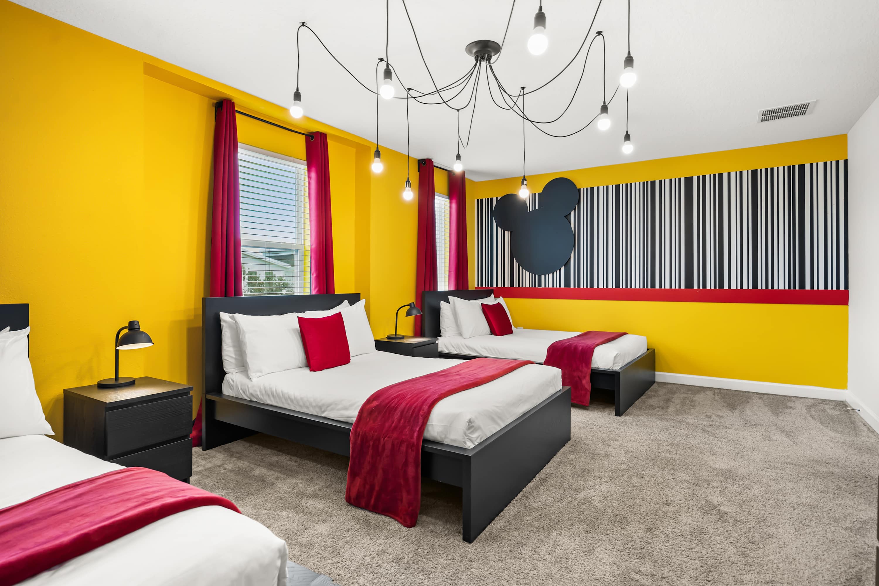 Themed bedroom with multiple beds, perfect for kids or group stays.