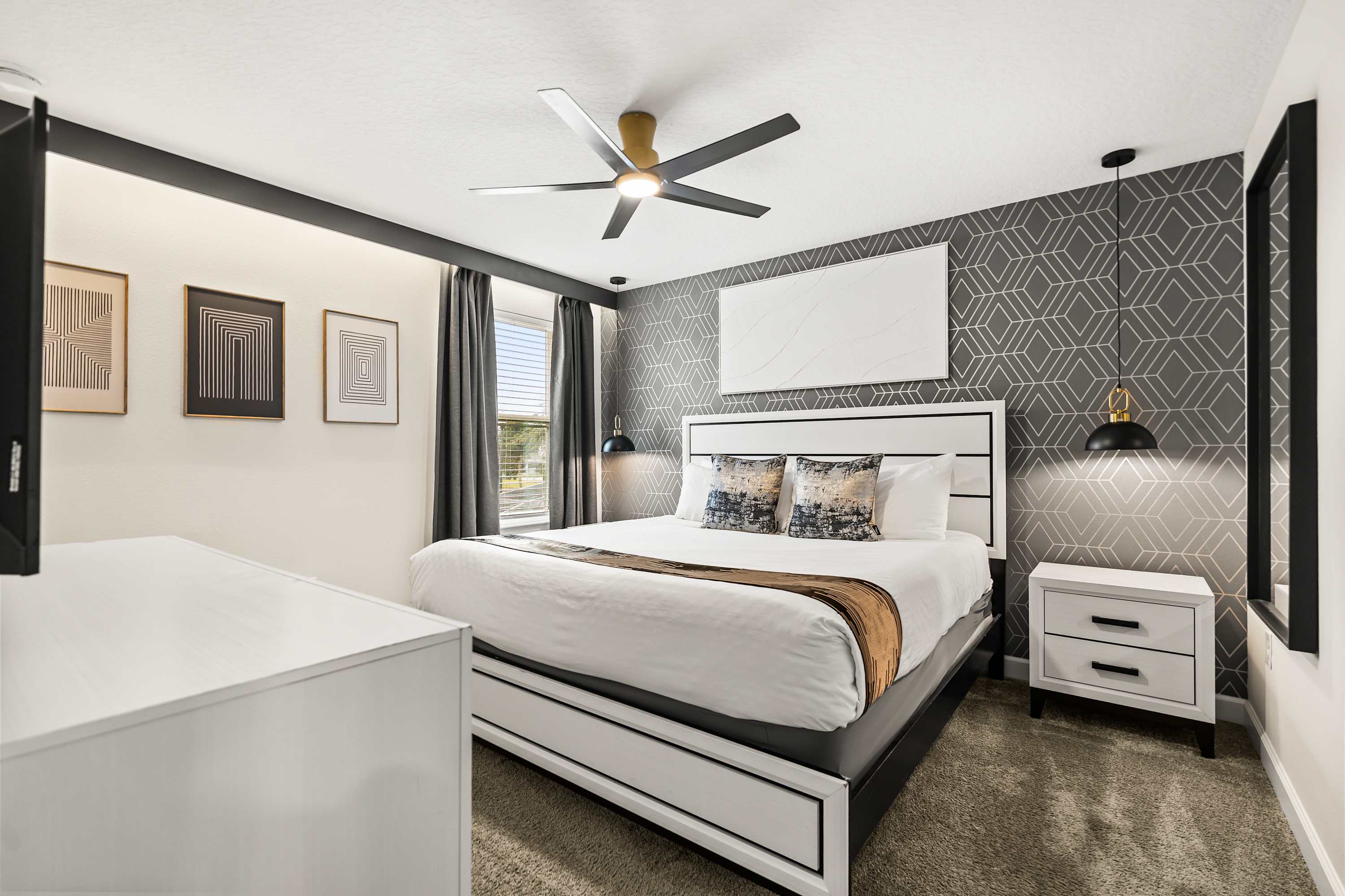 Stylish bedroom with accent wall, king bed.