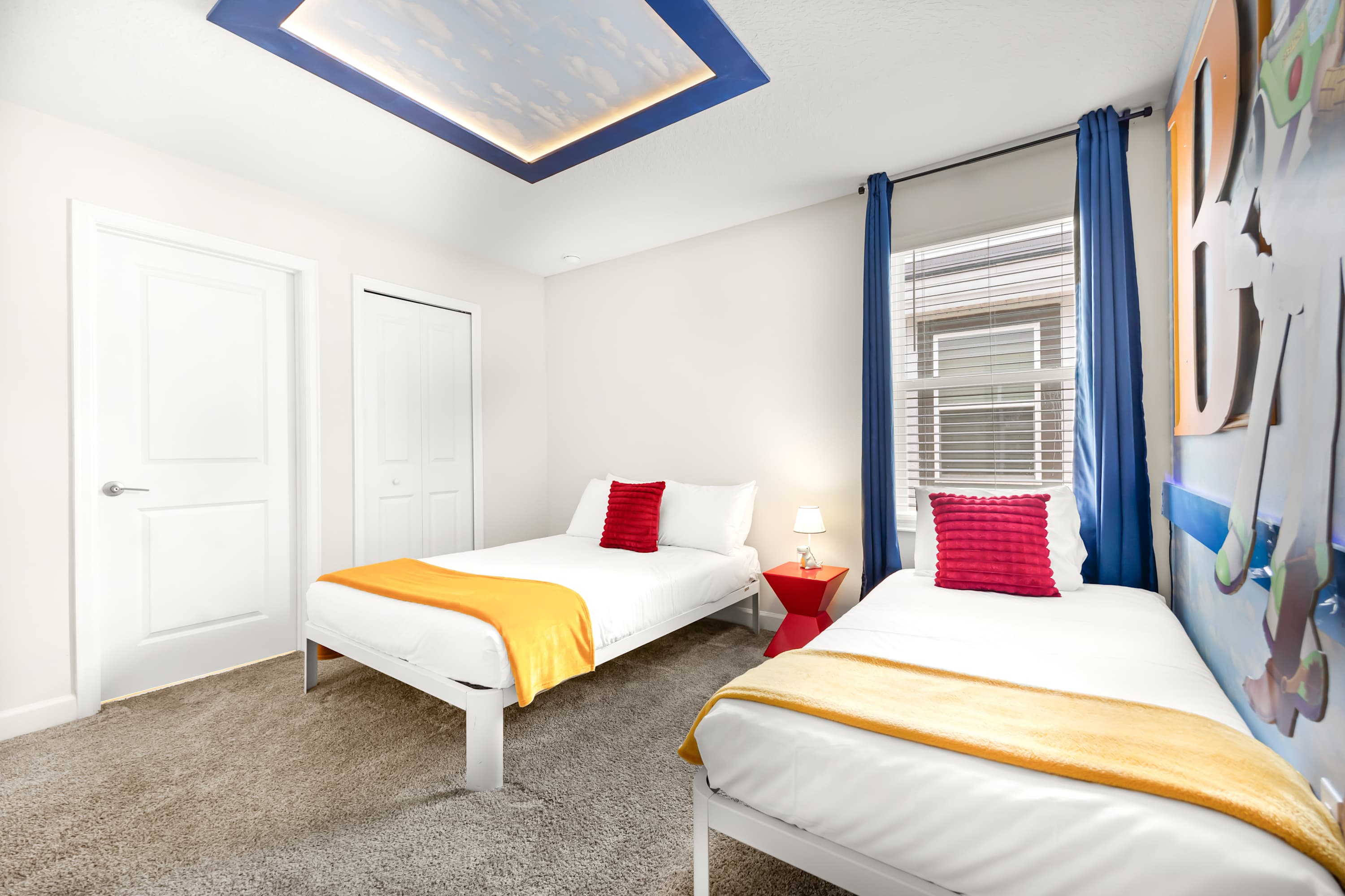 Twin bedroom with two beds, bright layout, and playful design details.