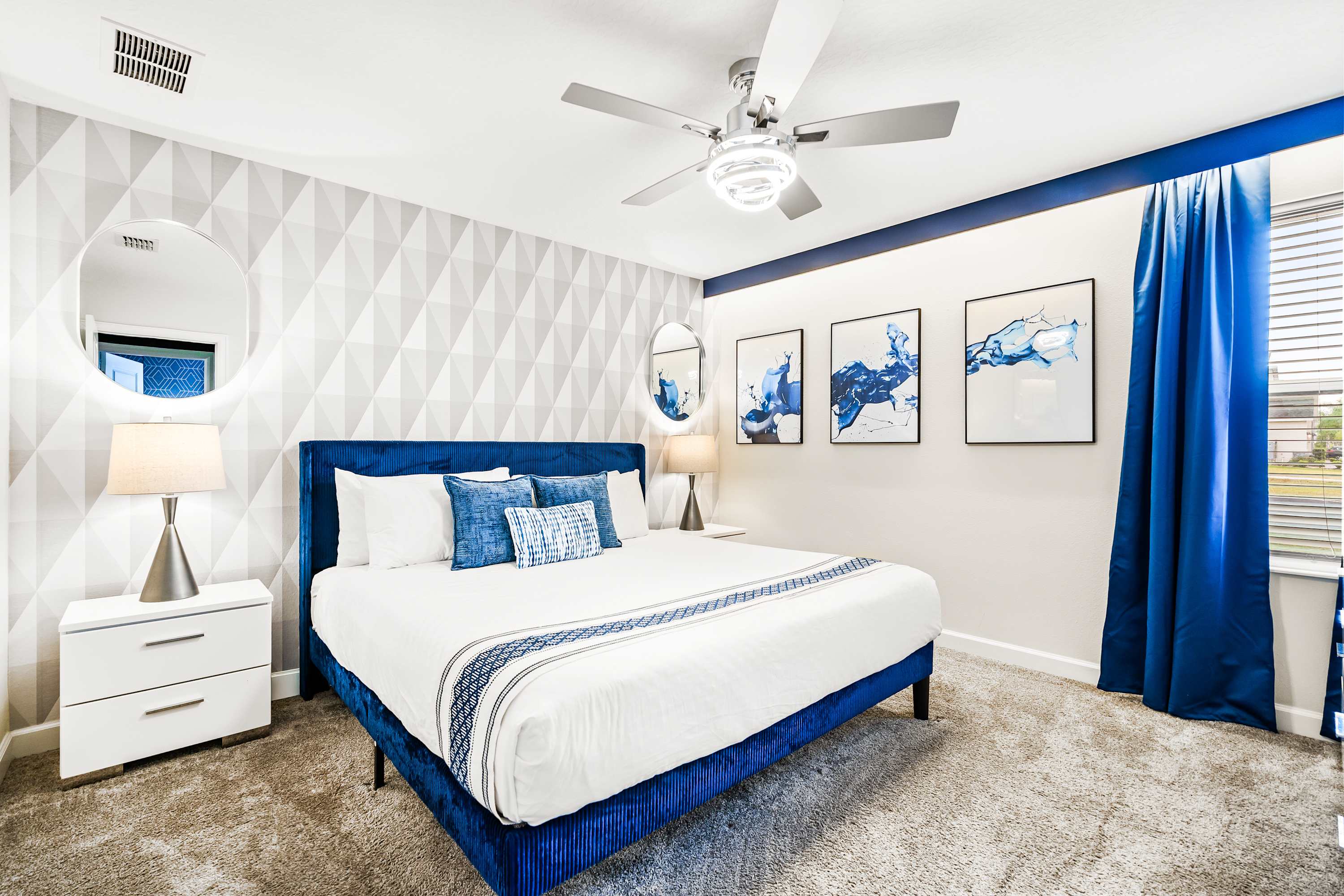 Comfortable bedroom with king bed, soft tones, and a relaxing atmosphere.