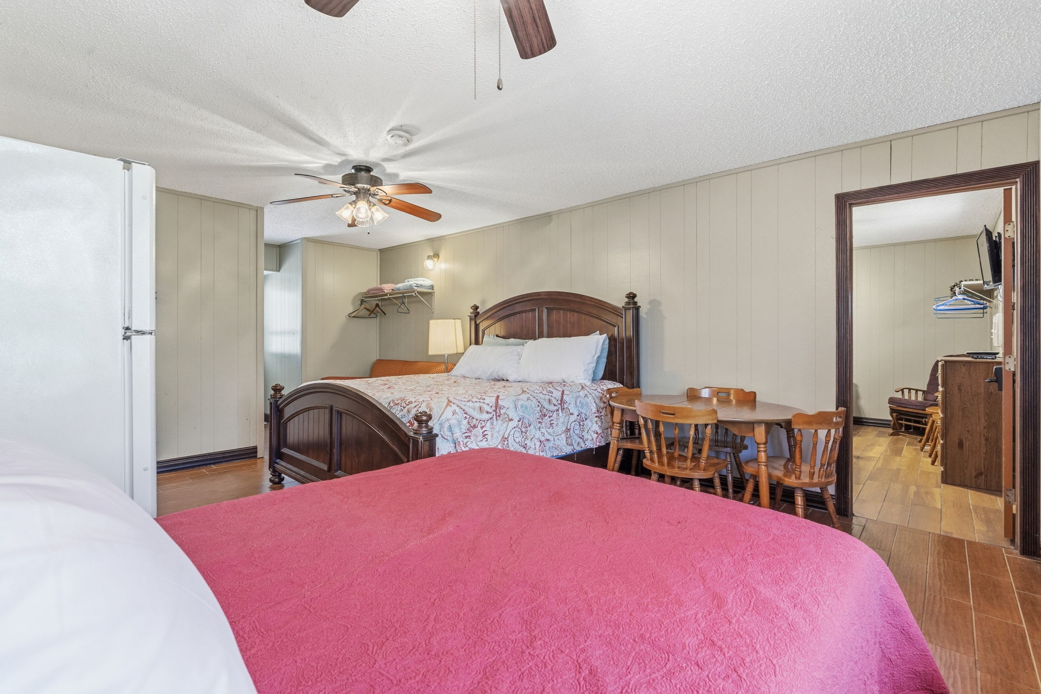 Studio bedroom with king and double bed, viewing entryway to bedroom 2