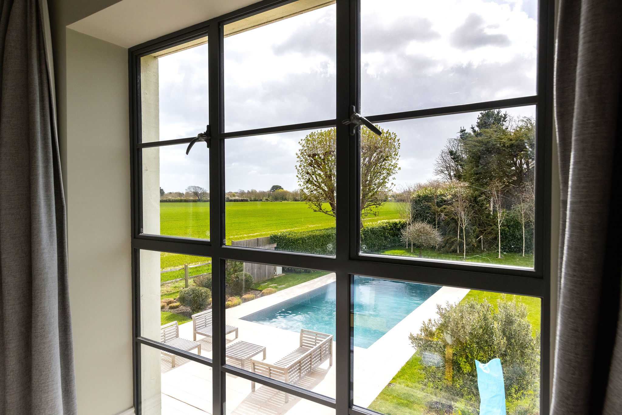 Enjoy gorgeous views of the heated pool and surrounding countryside from the upper floor.