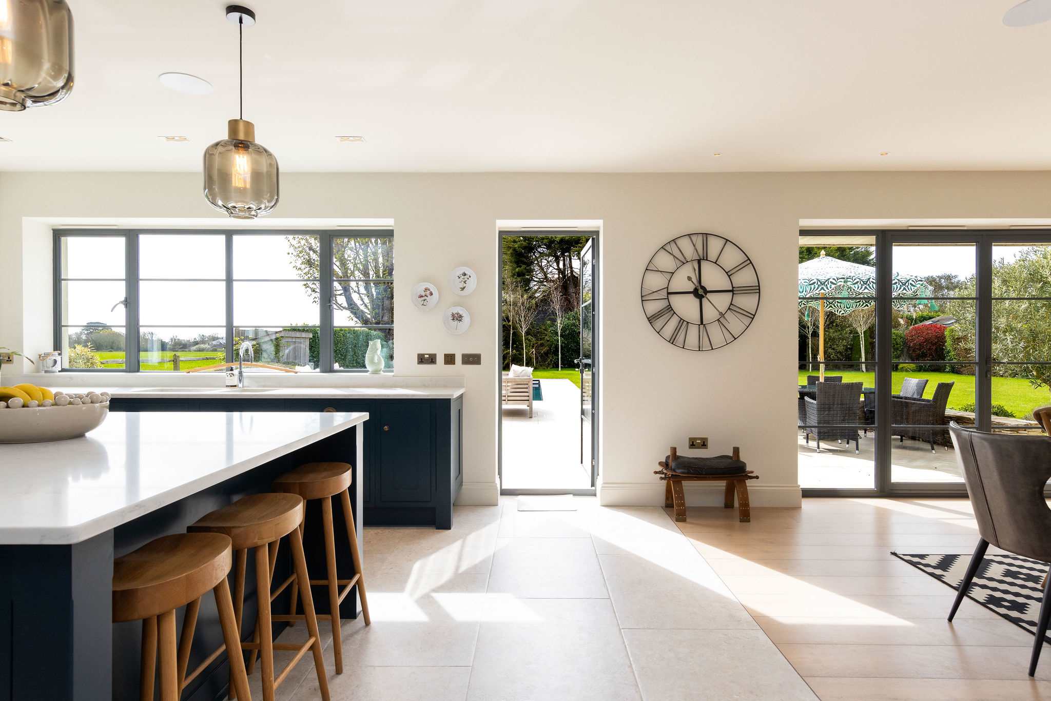 Seamless indoor-outdoor flow from the spacious kitchen to the sun-drenched landscaped garden beyond.