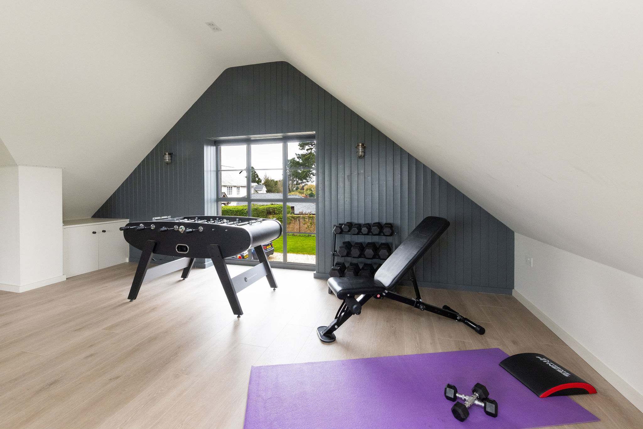 Stay active with gym equipment, foosball, and plenty of space for a workout session.