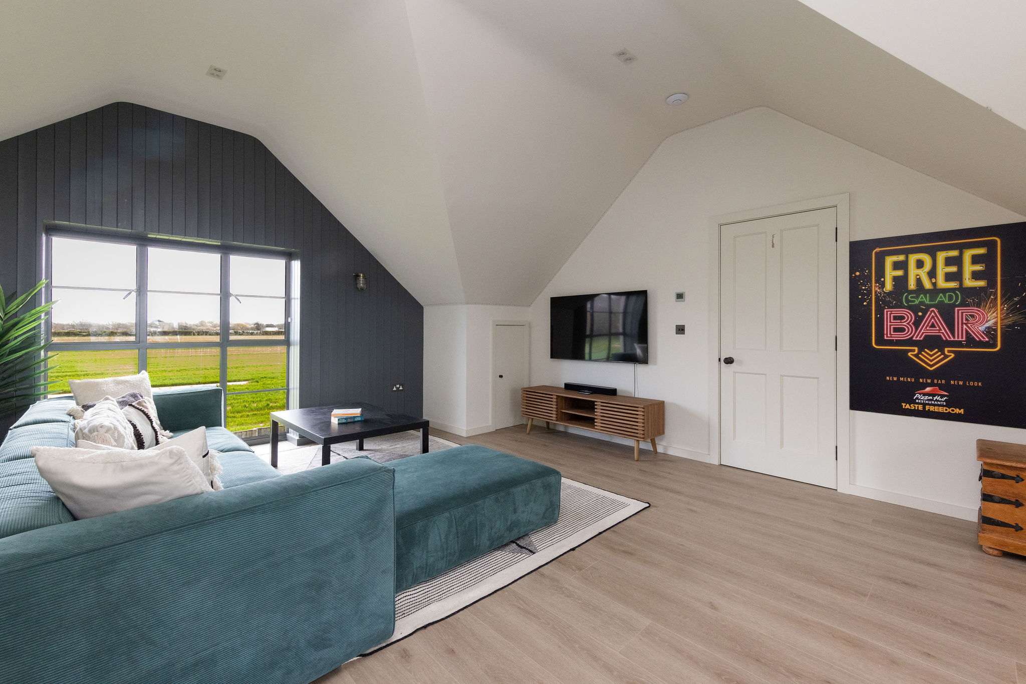 Chill-out zone with Smart TV, comfy sofas, and fun décor — a great space for all ages.
