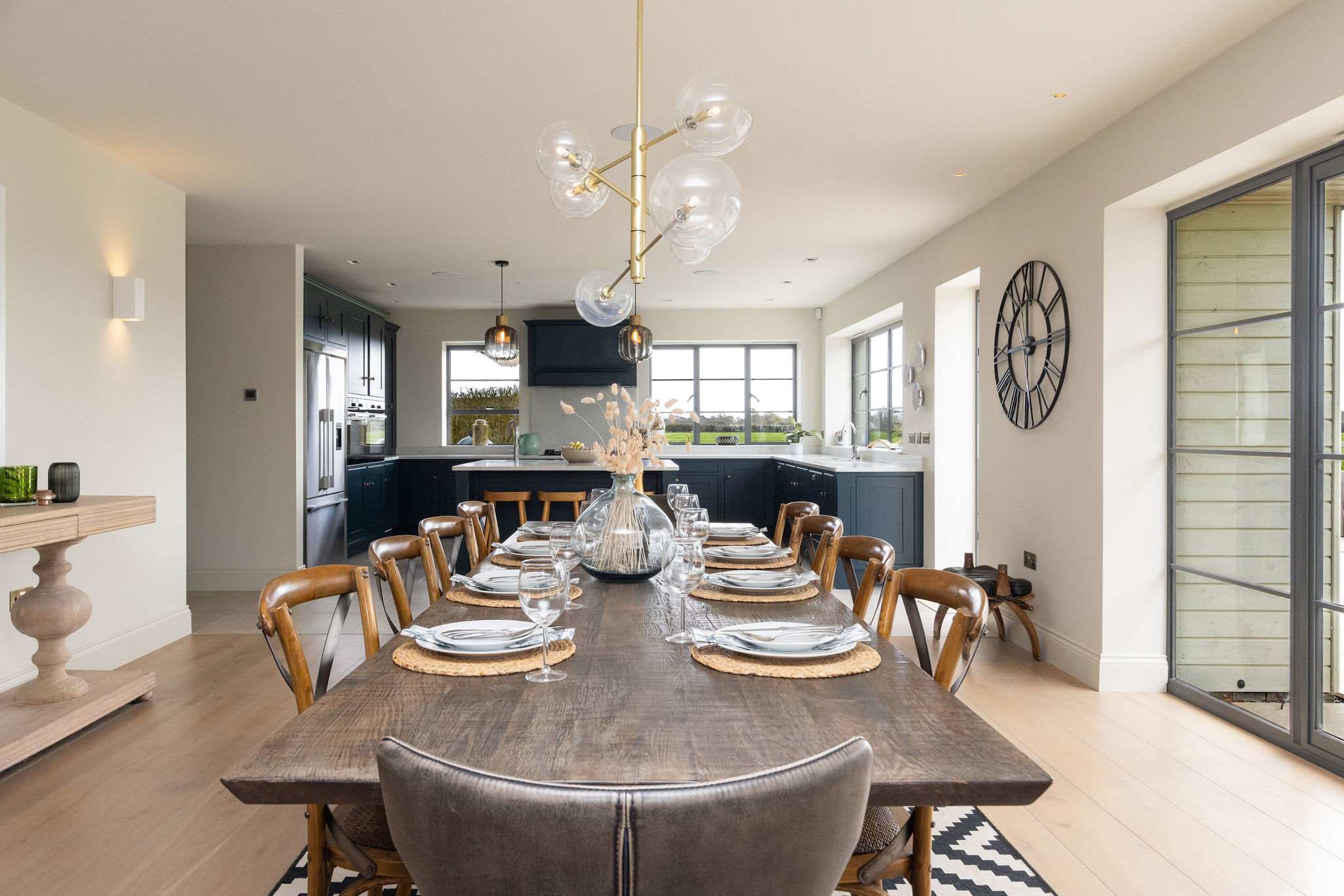 Elegantly set dining table ready for special occasions, comfortably seating the whole group.