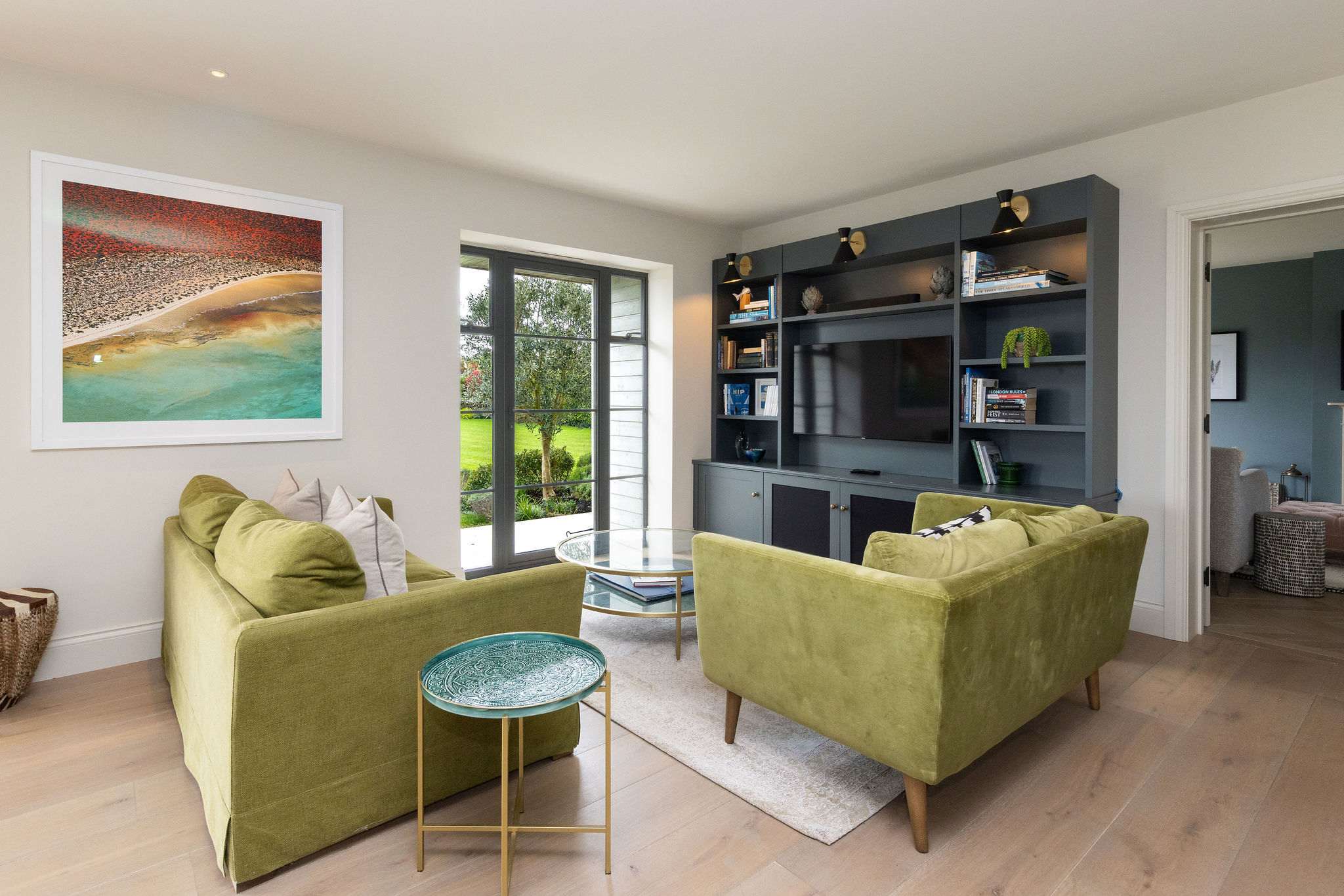 Kick back in the relaxed living area with Smart TV, garden views, and comfortable seating.