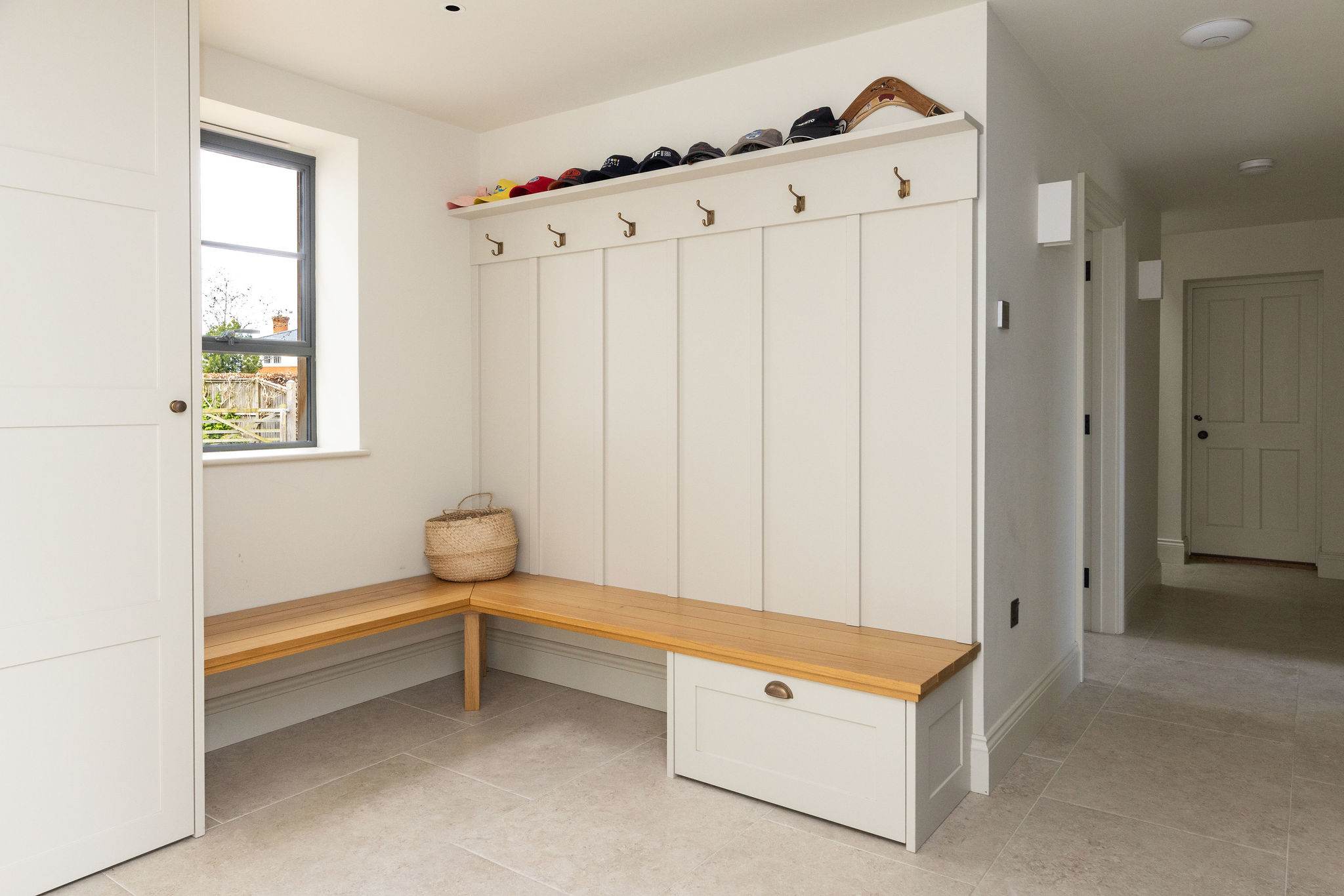 Practical boot room with built-in storage, perfect for stashing coats and shoes after coastal walks.