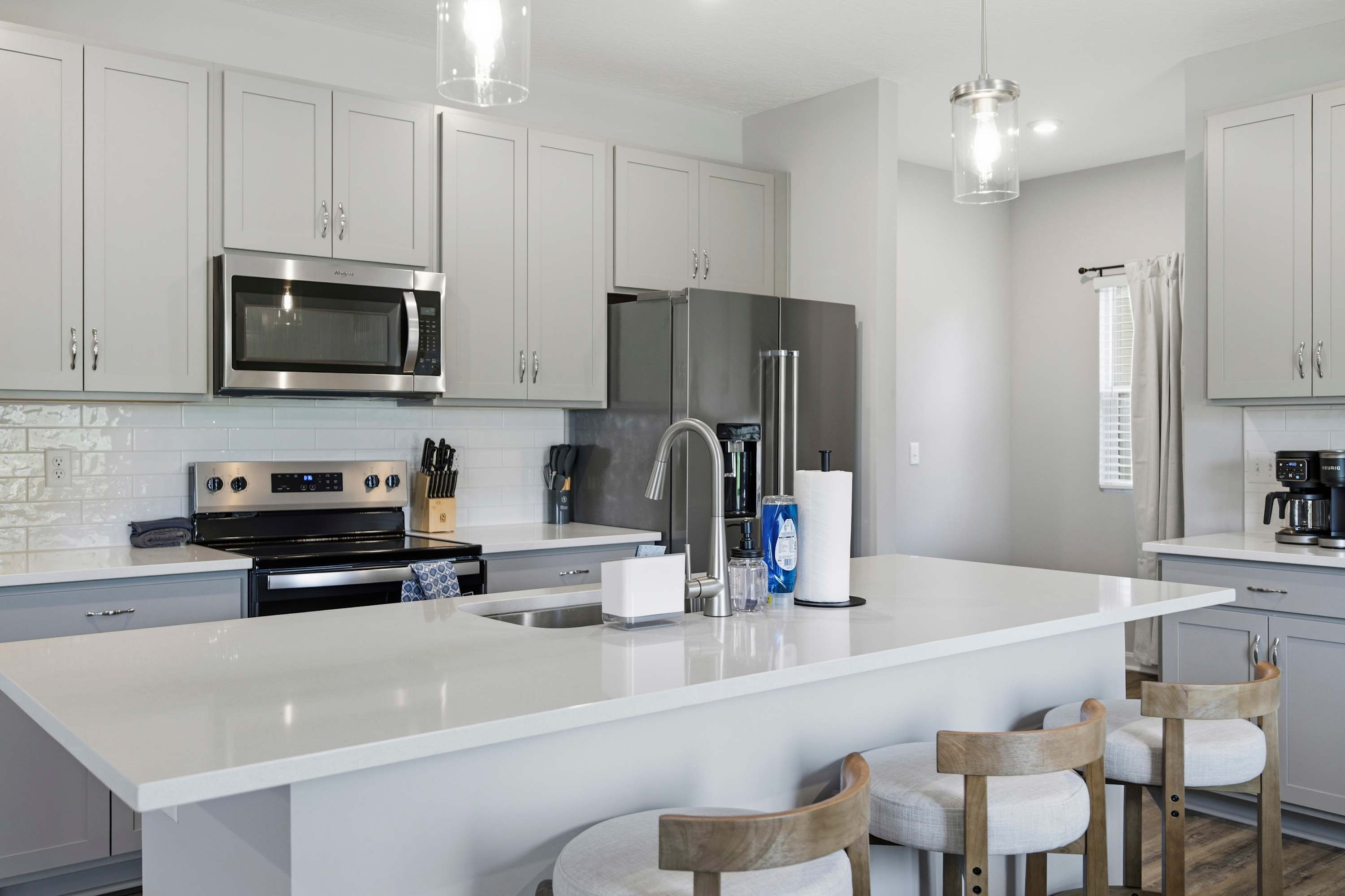 The open kitchen offers ample space & all the comforts of home​