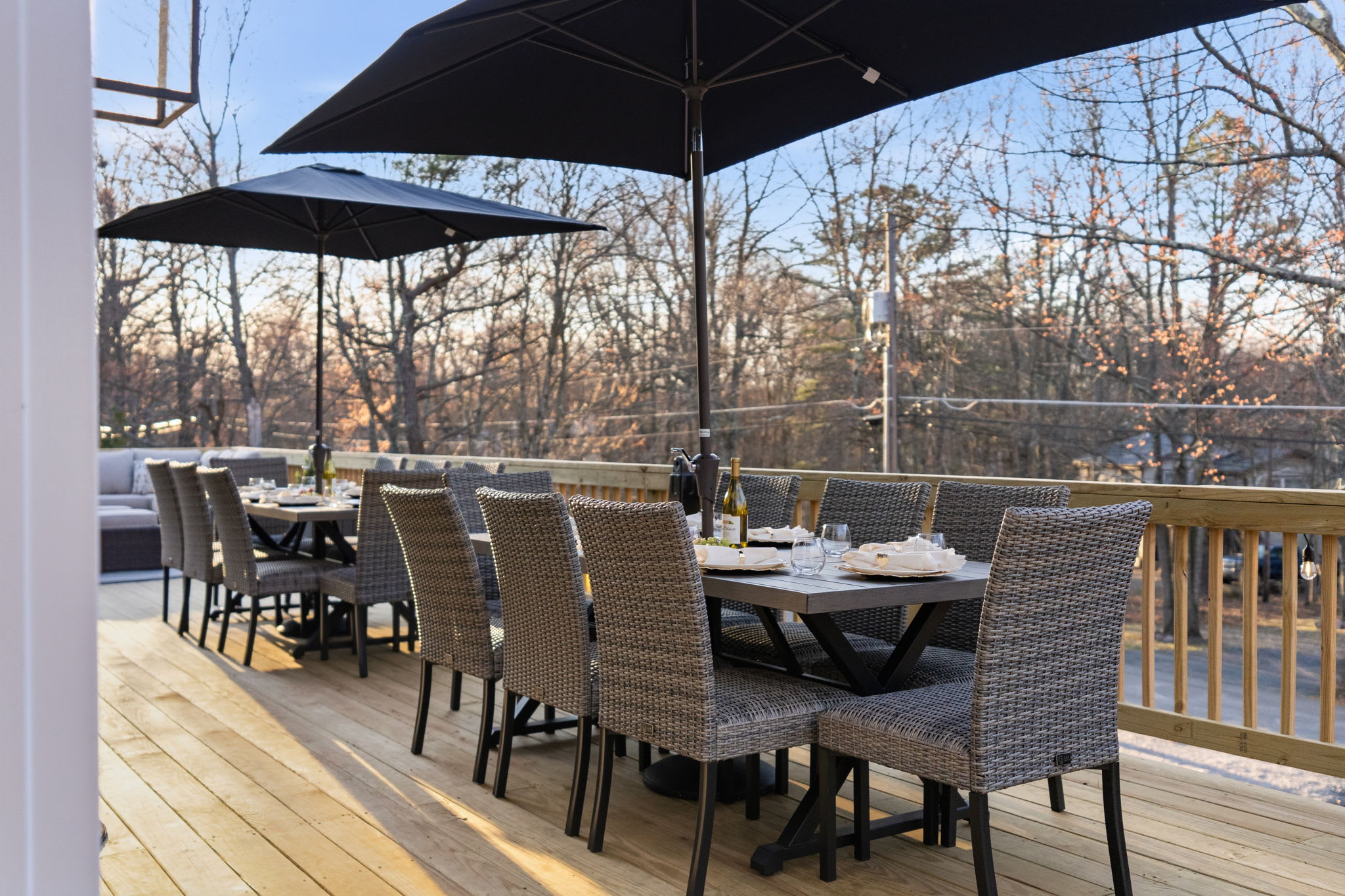 Al fresco dining for the whole group under umbrellas on the expansive deck