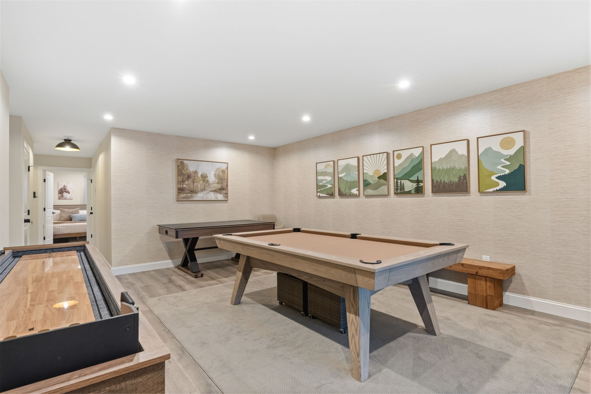 Game room with pool table, shuffleboard, and air hockey for friendly competition