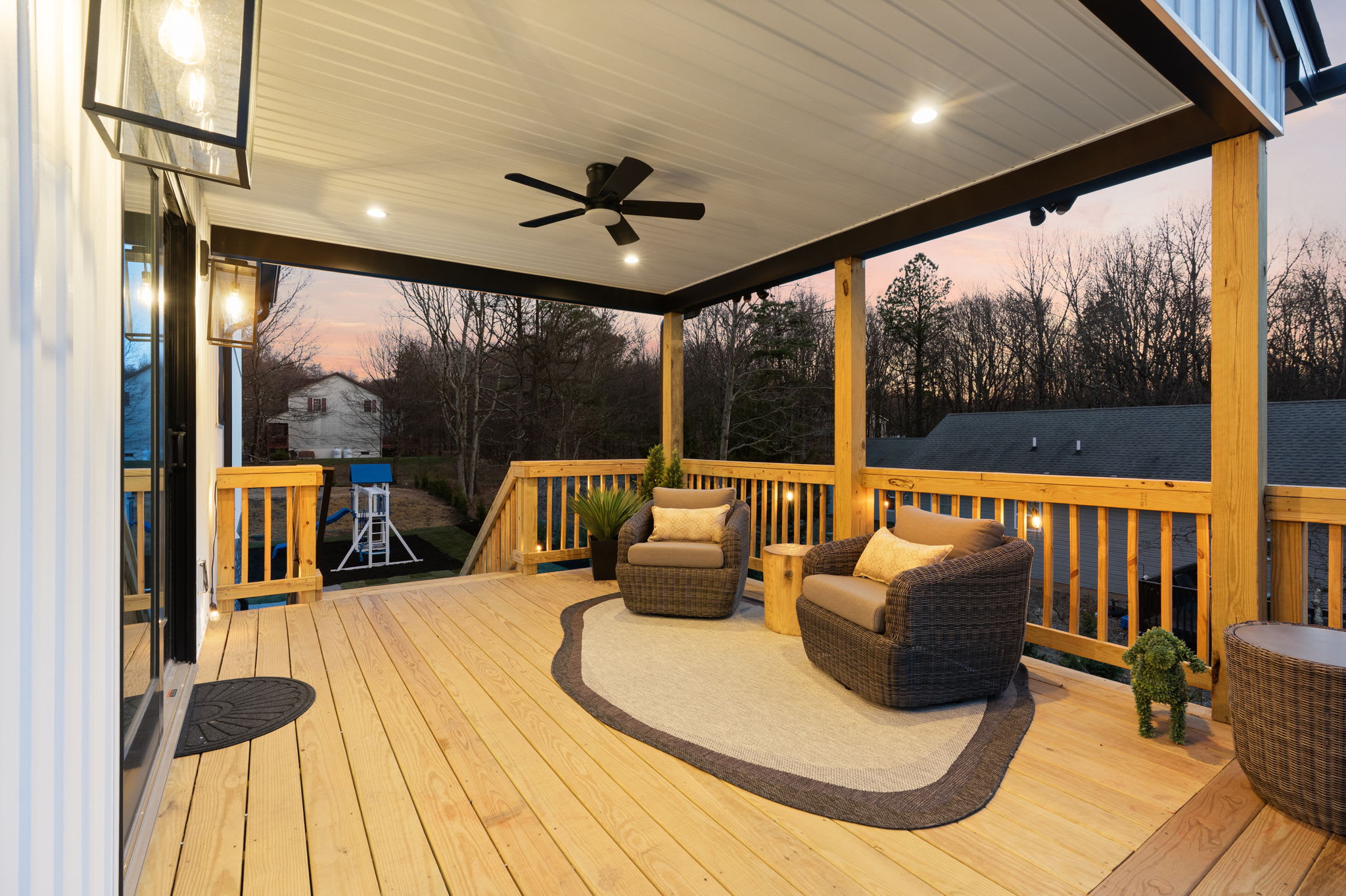 Covered porch lounge bathed in sunset light, perfect for slow evenings