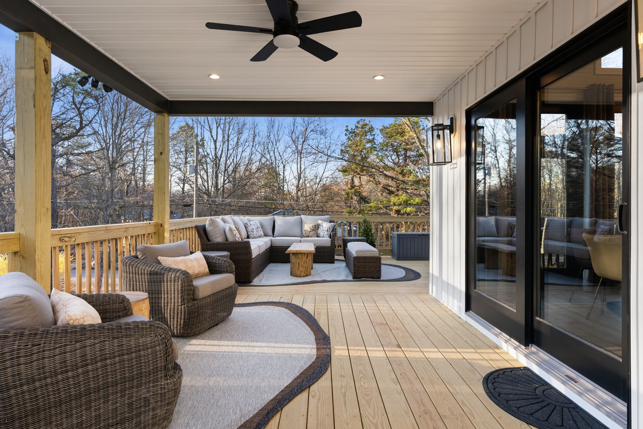 Sunset glow on the deck and exterior with mountain-modern stone accents