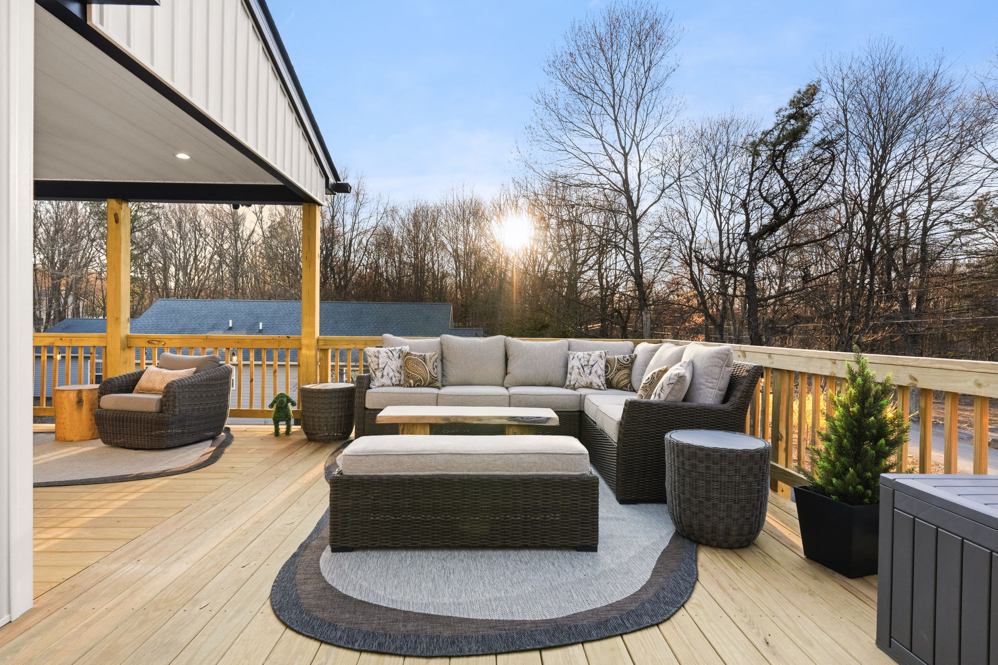 Sunset deck sectional with string lights — perfect spot to gather after dinner