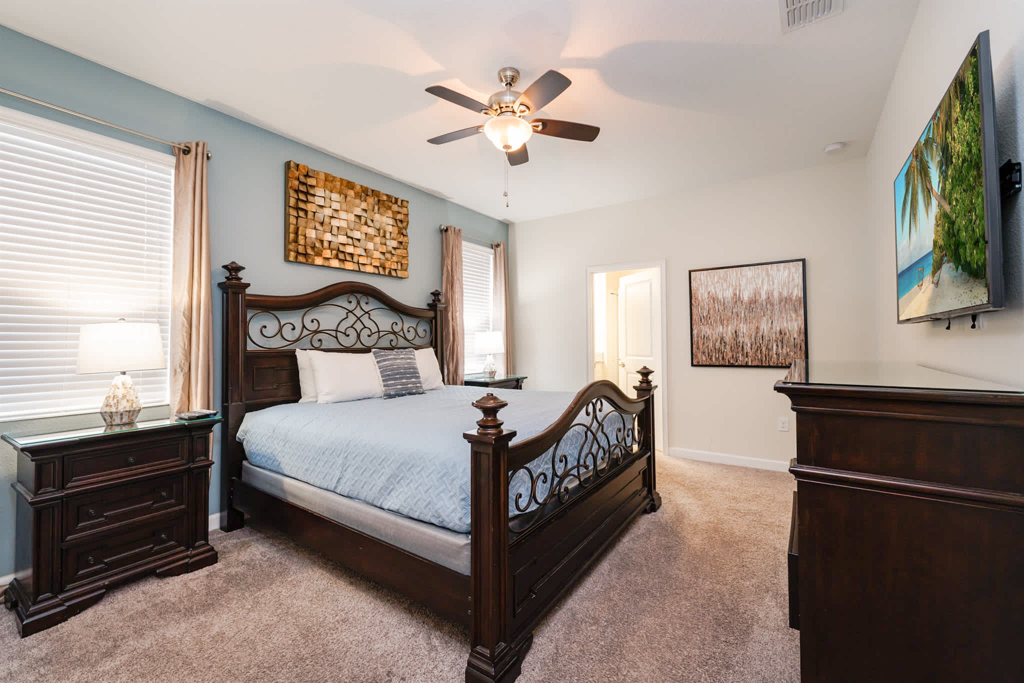 Relax in this elegant bedroom with a king-size bed, stylish decor, and a flat-screen TV for your entertainment.