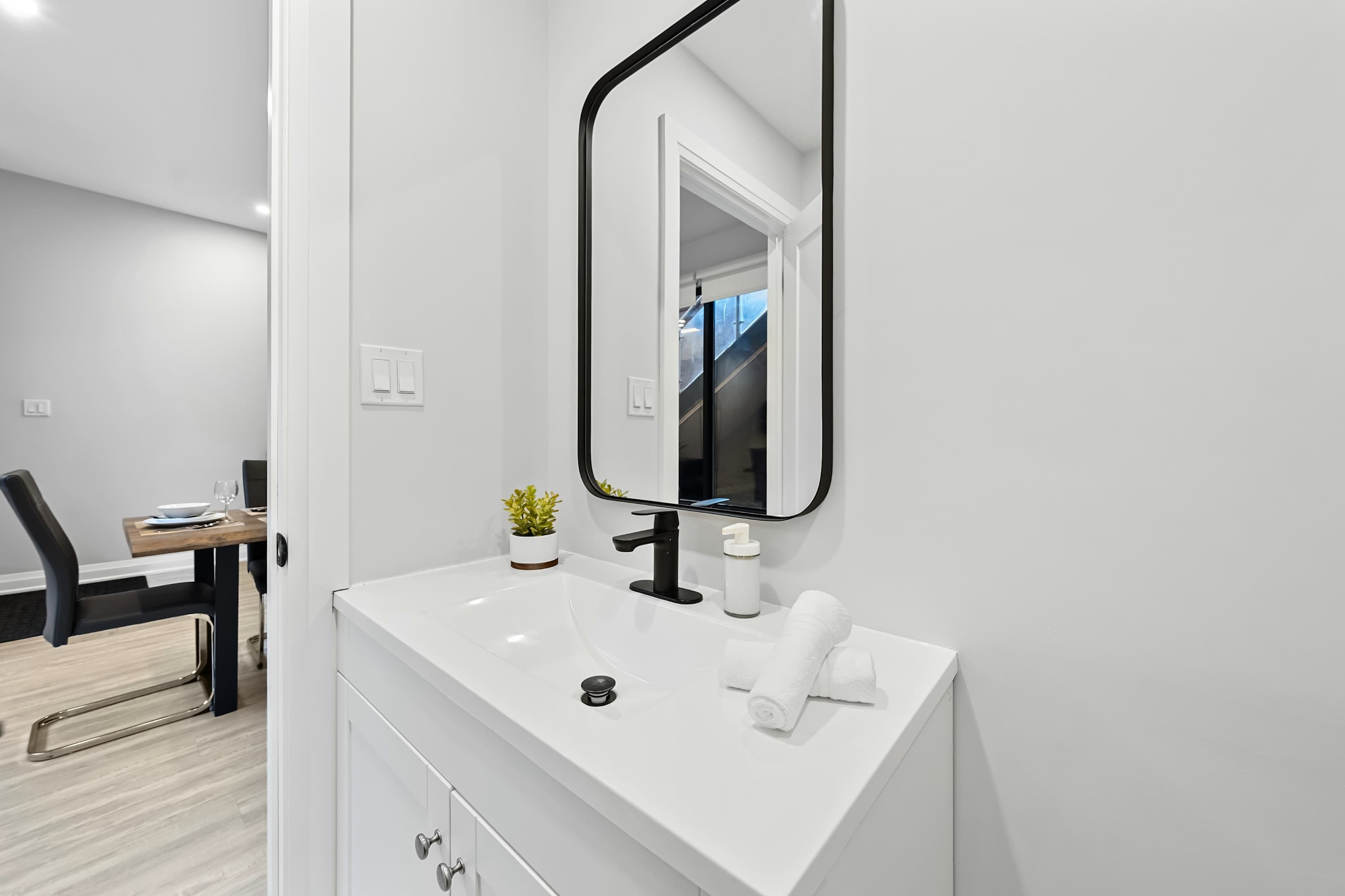 Bathroom conveniently located near the dining area for easy access.