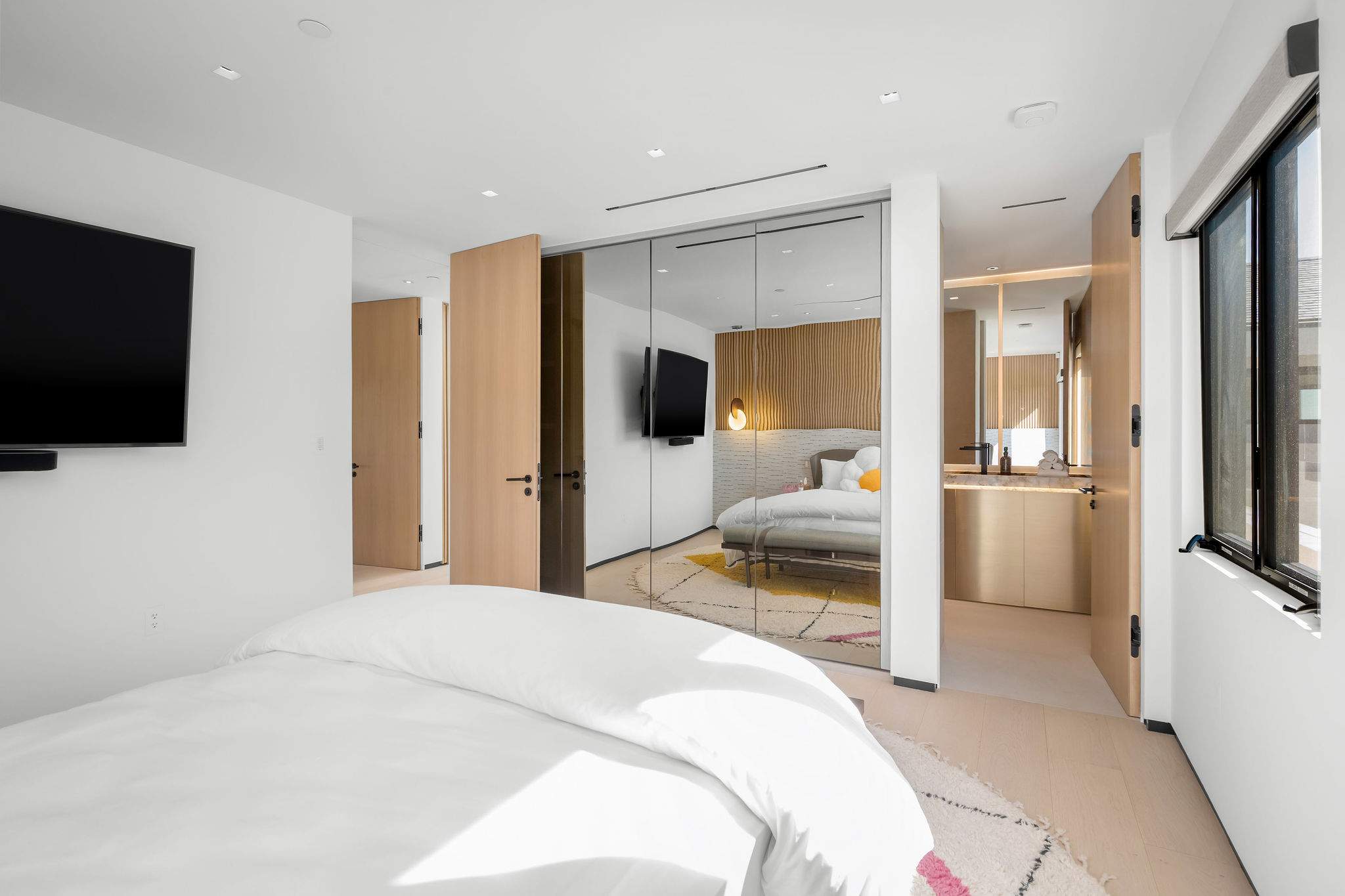 Move from bed straight into your private bathroom, all within one connected layout.