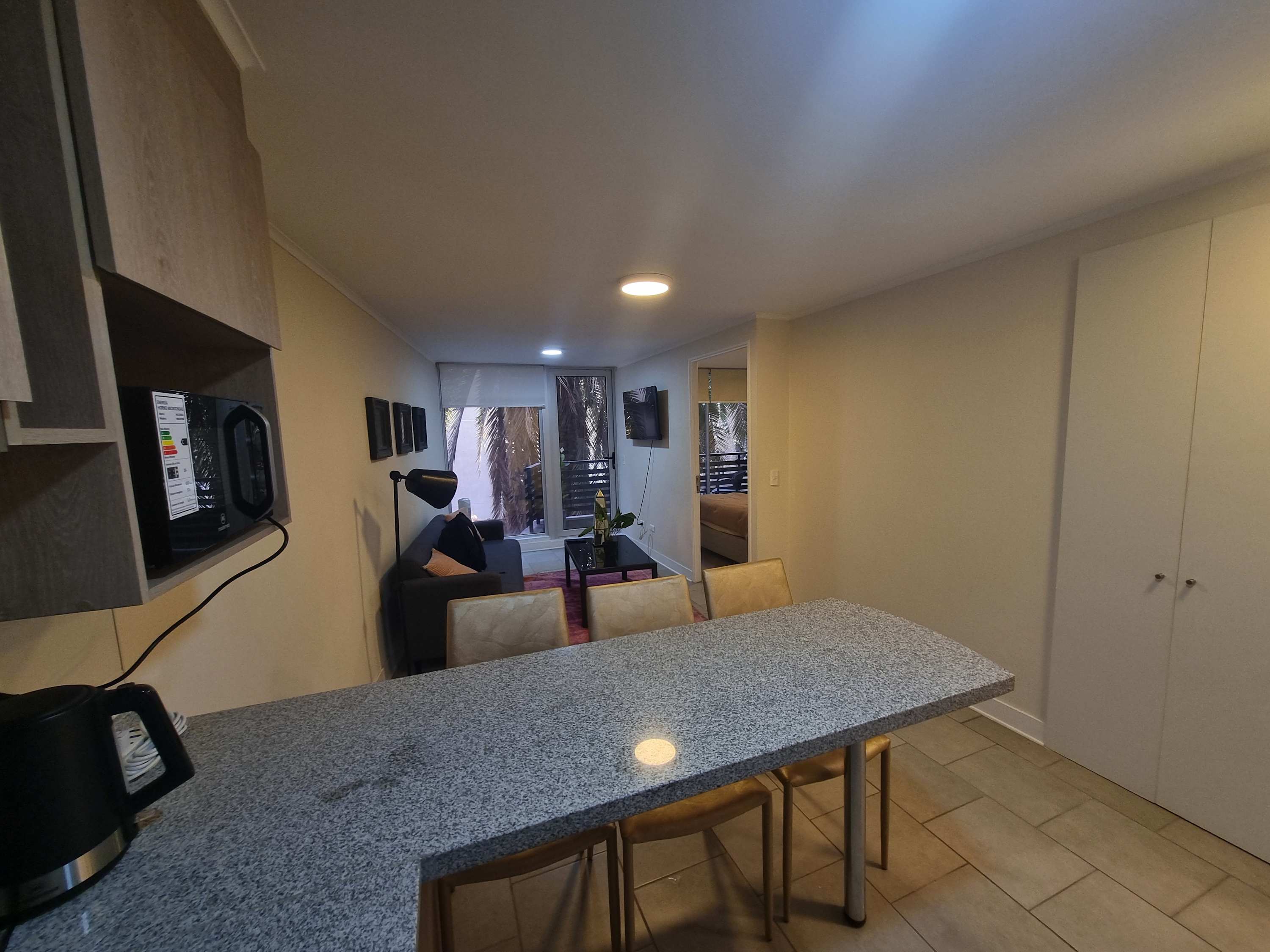 Cozy studio apartment with a comfortable living area and modern amenities, perfect for a relaxing stay.