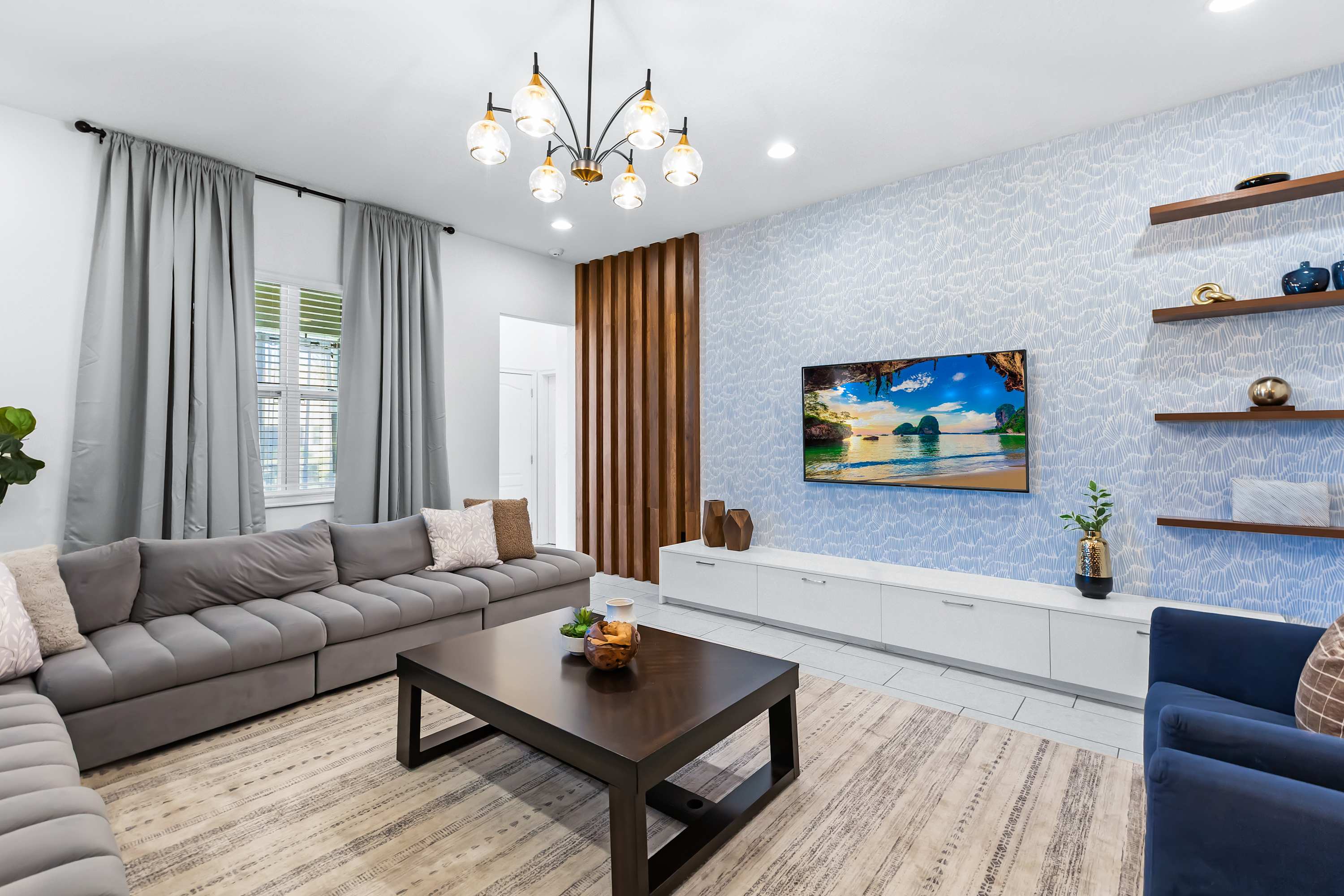 pacious lounge area with large sectional and natural light.