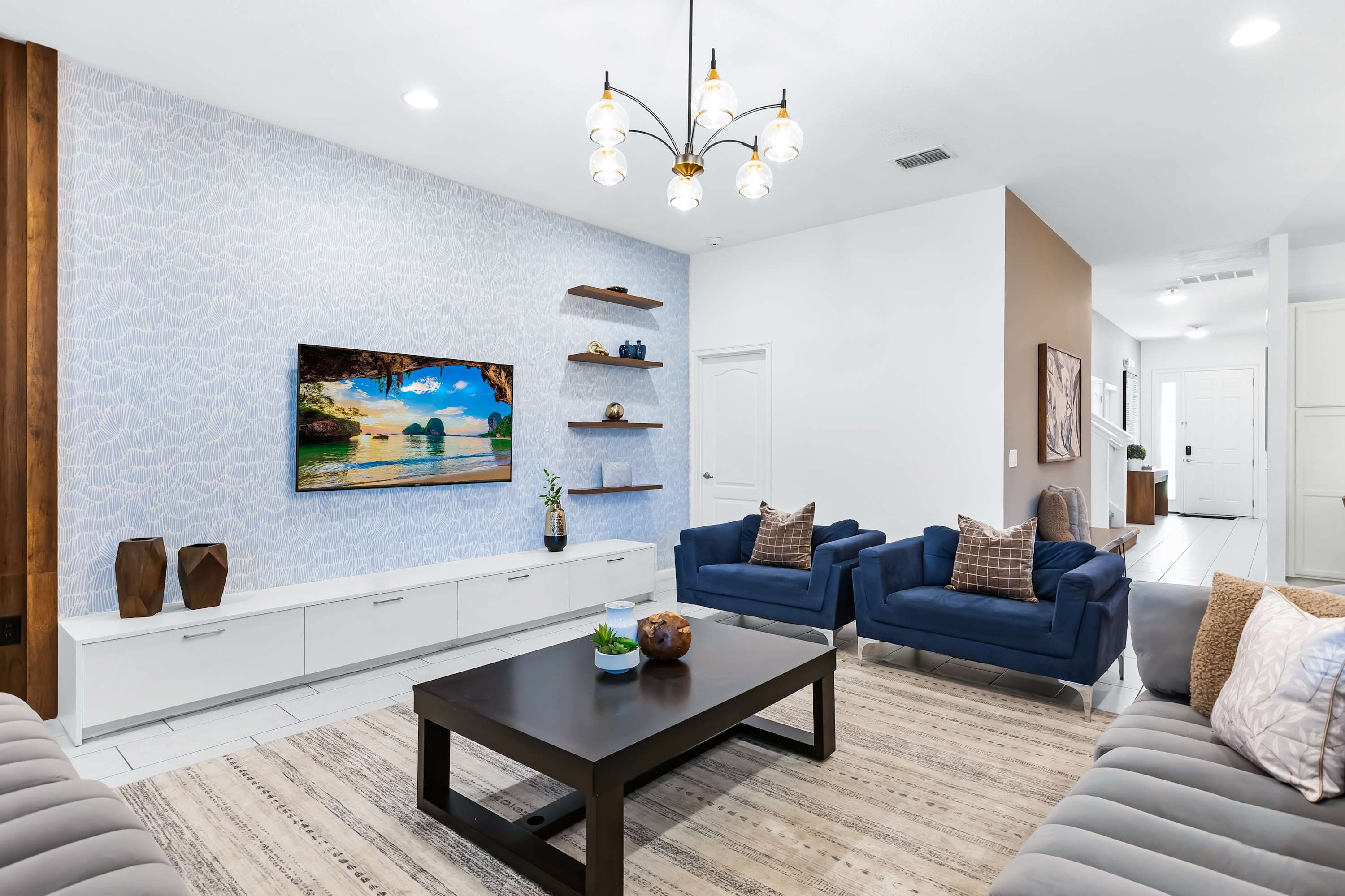 Bright living room with modern décor and comfortable seating.