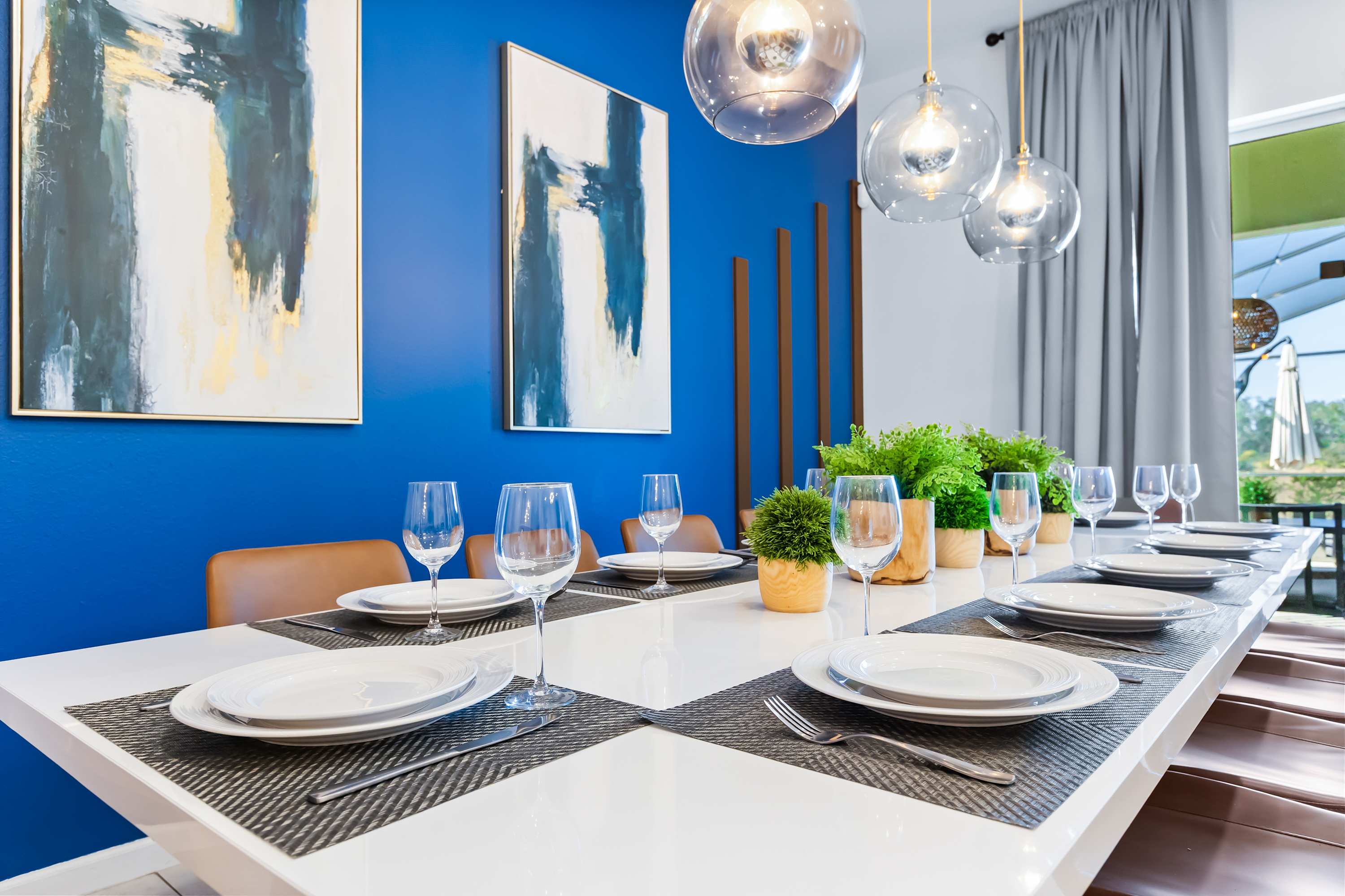 Elegant dining table setup with modern décor and seating for the whole group.