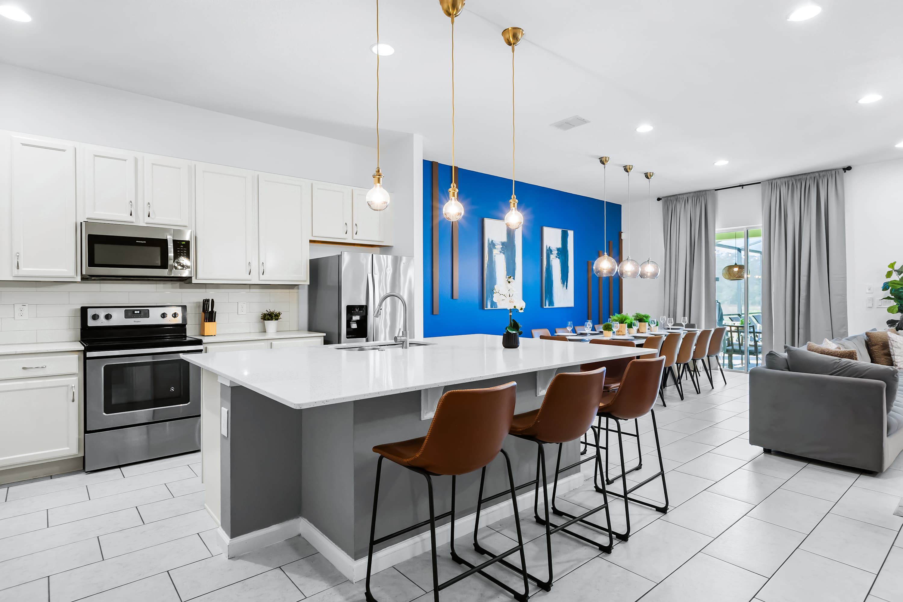 Fully equipped kitchen with spacious island and bar seating.